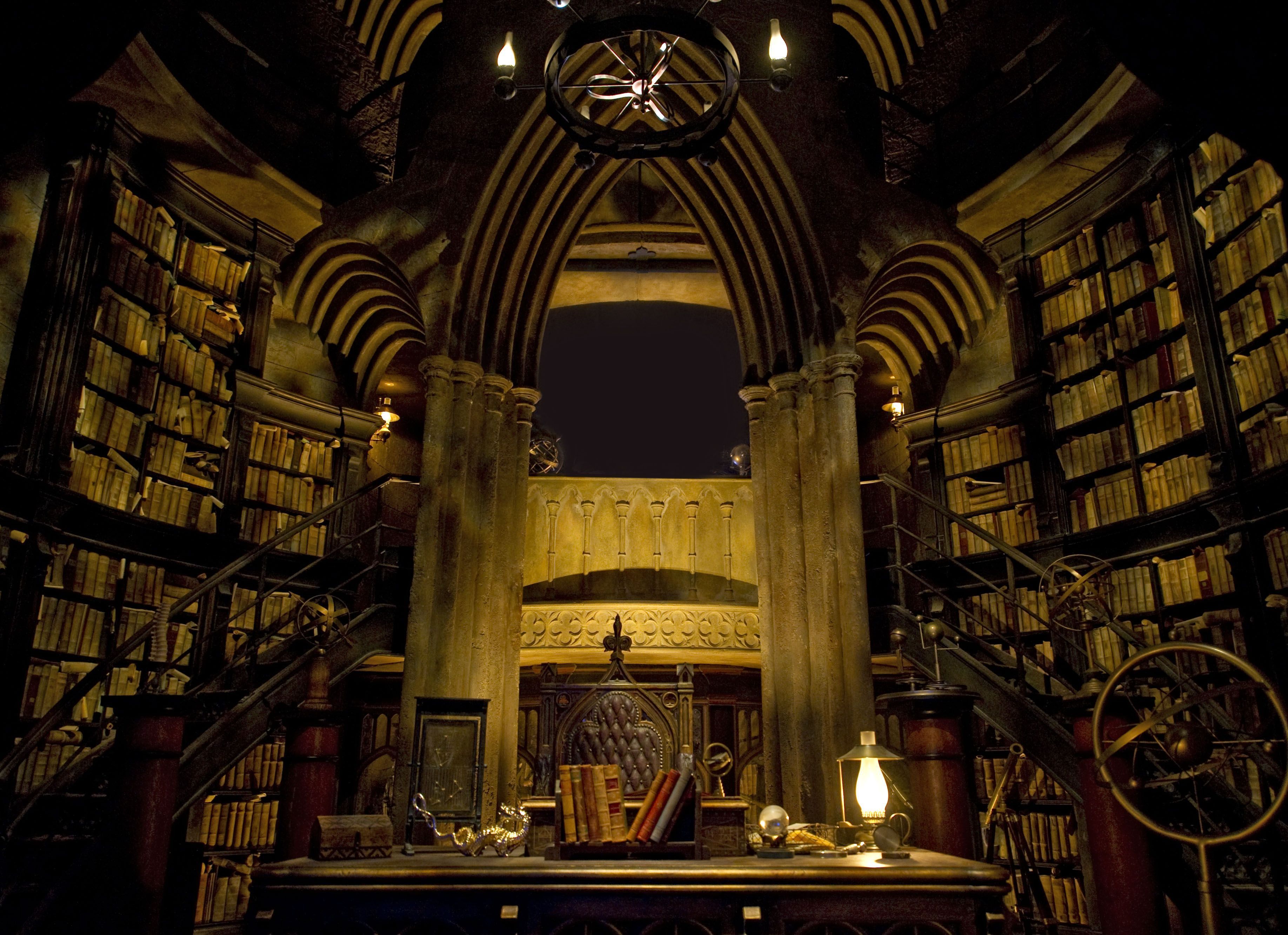 The interior of the library is dark and filled with books. - Library, steampunk