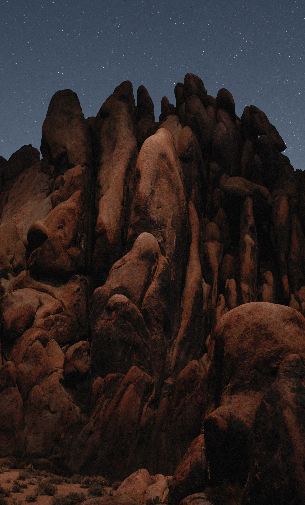 A rock formation in the desert at night - Rocks