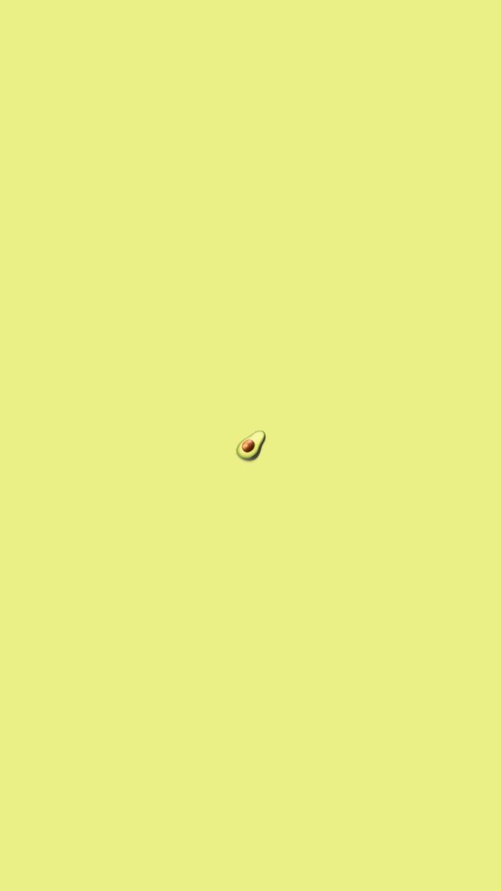 A small avocado on top of an orange background - Avocado