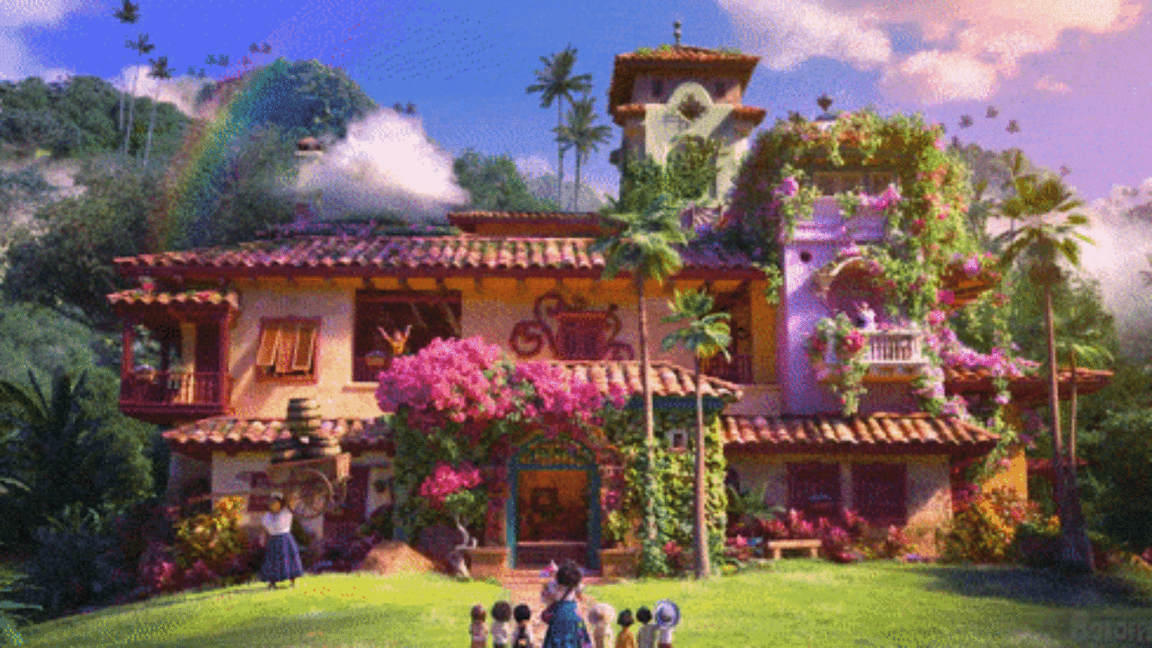 A colorful house in a lush garden with a rainbow in the sky. - Encanto