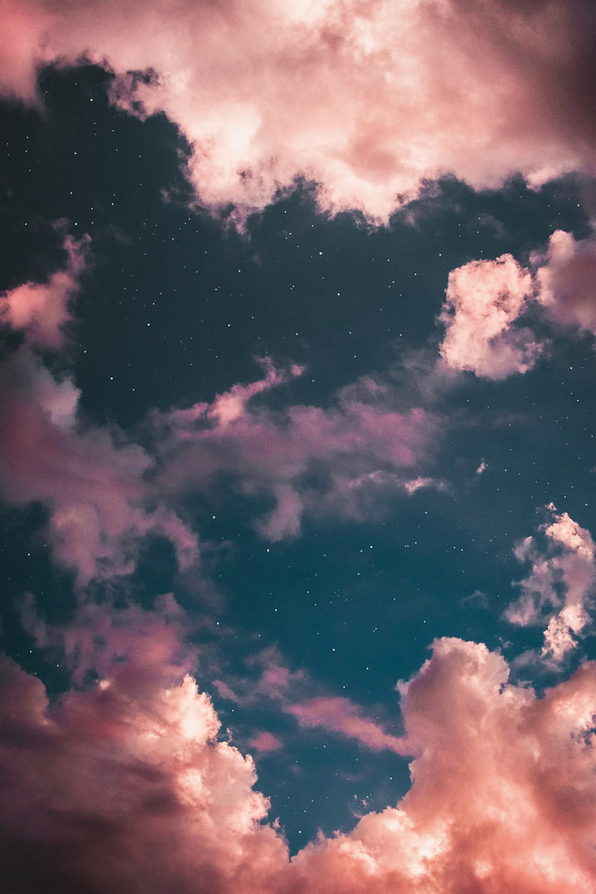 A cloudy sky with some stars in it - Vintage clouds