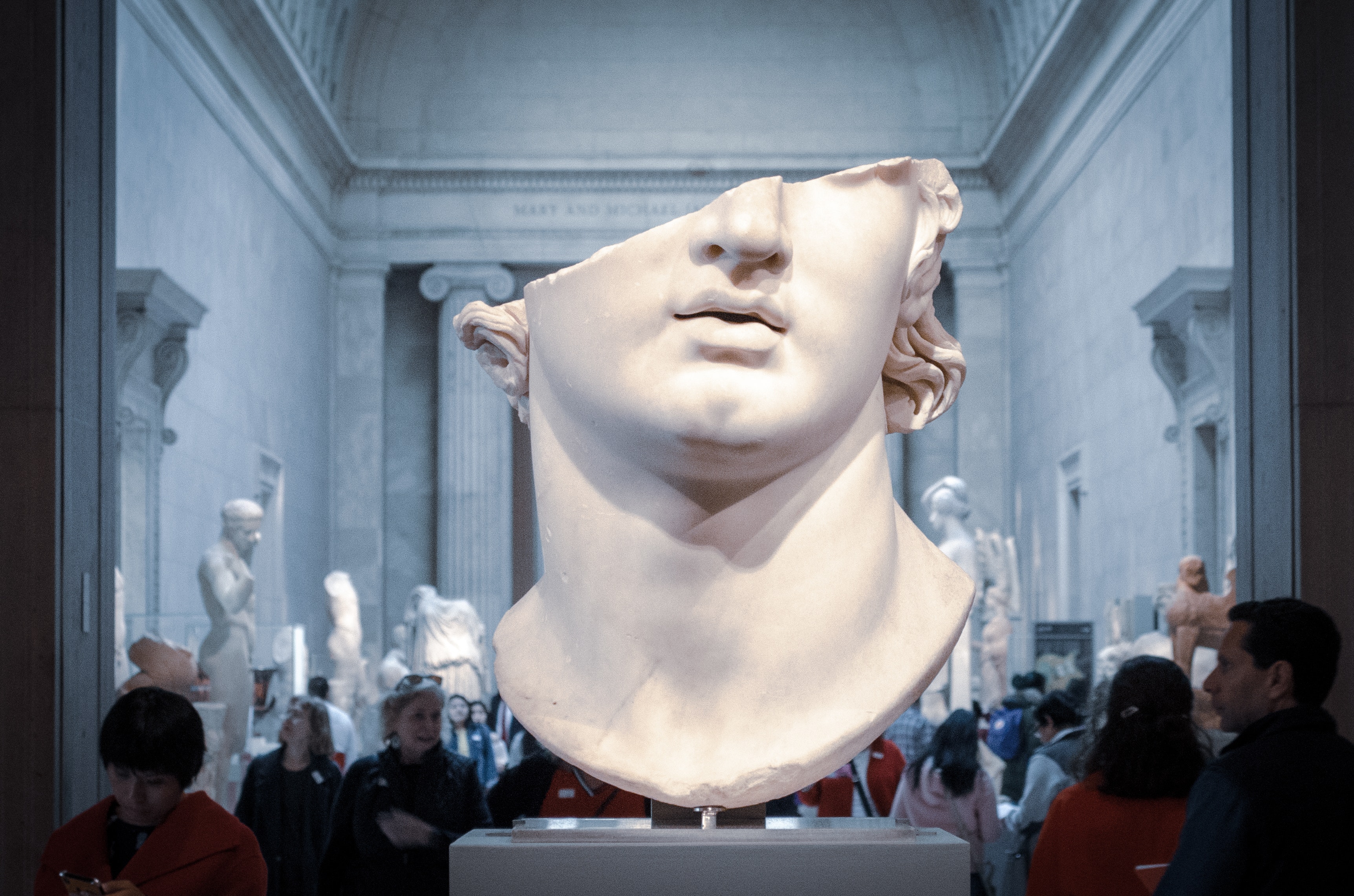 A white statue of the head and neck - Greek statue
