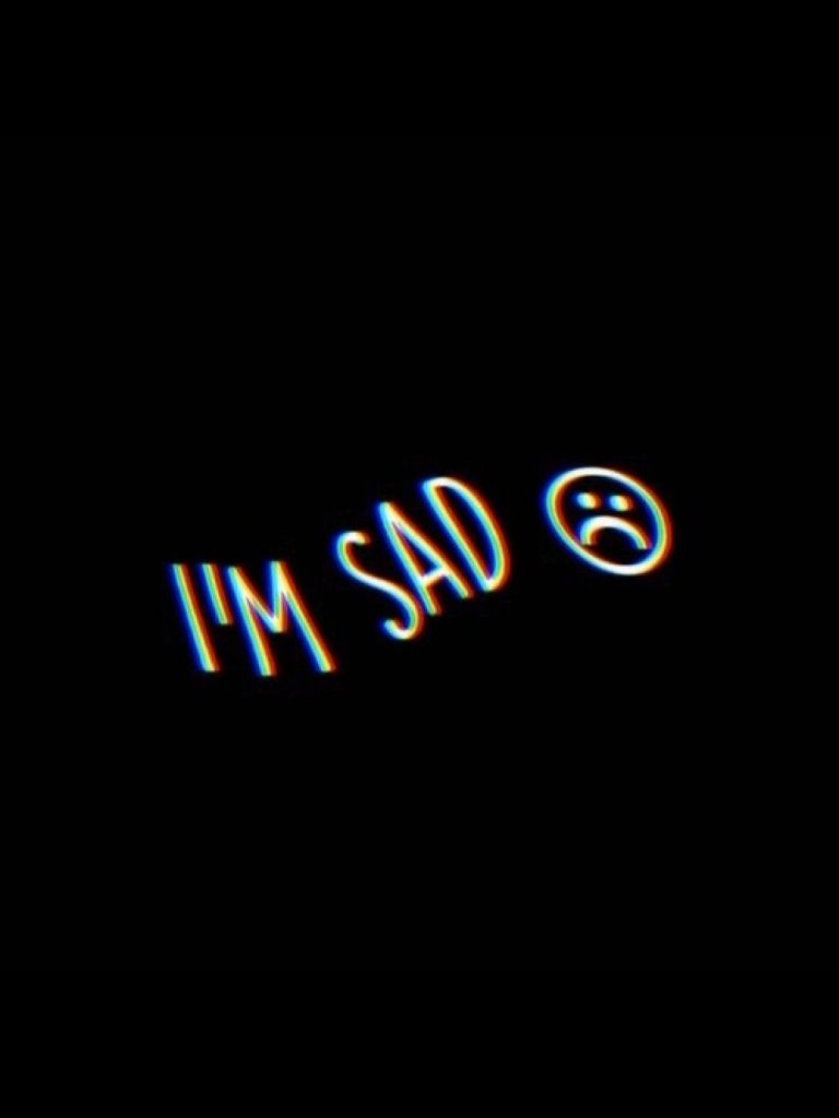 The text ``i'm sad'' is written in neon - Depressing