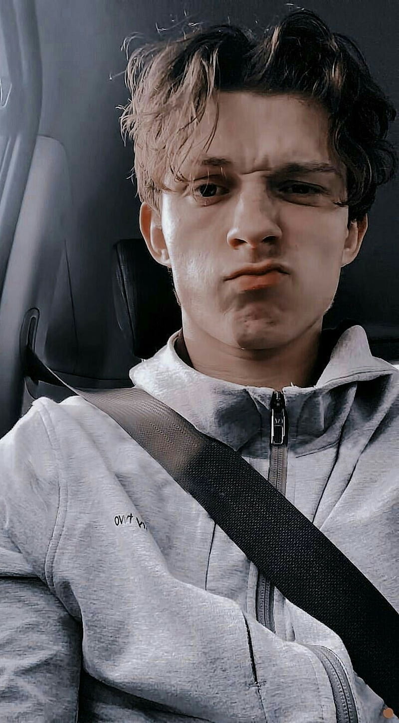 Tom Holland in a car with a seatbelt - Tom Holland