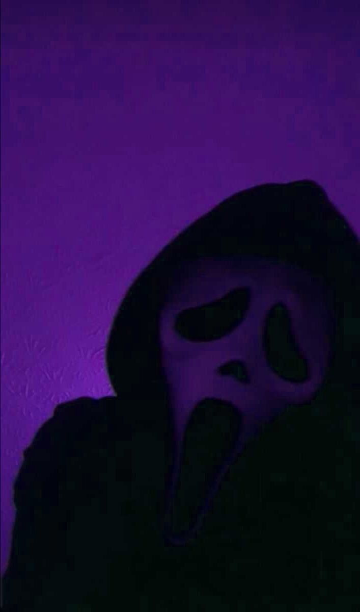 A person in the dark wearing an evil mask - Ghostface