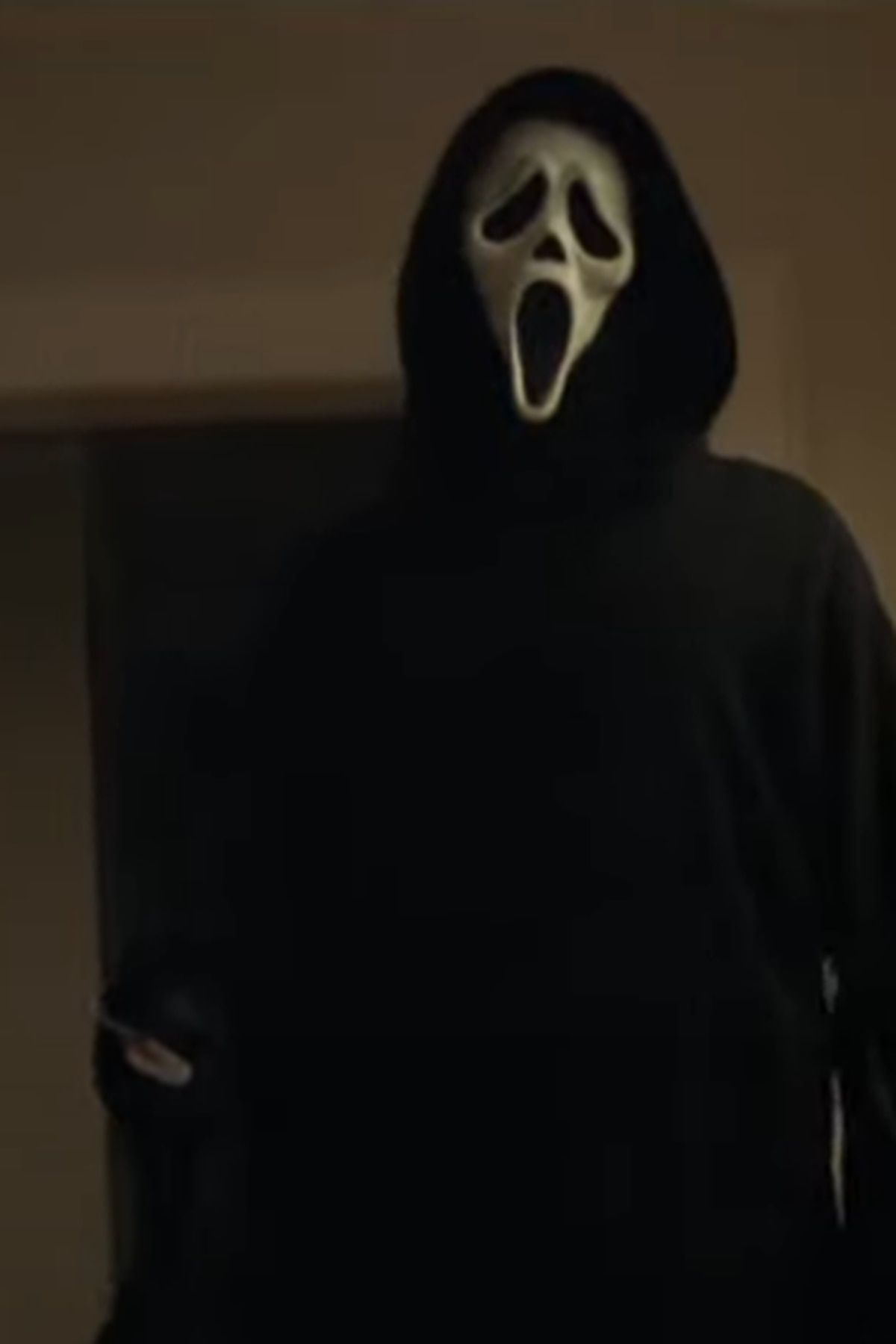 Ghostface holding a knife in the 2021 Scream movie - Ghostface