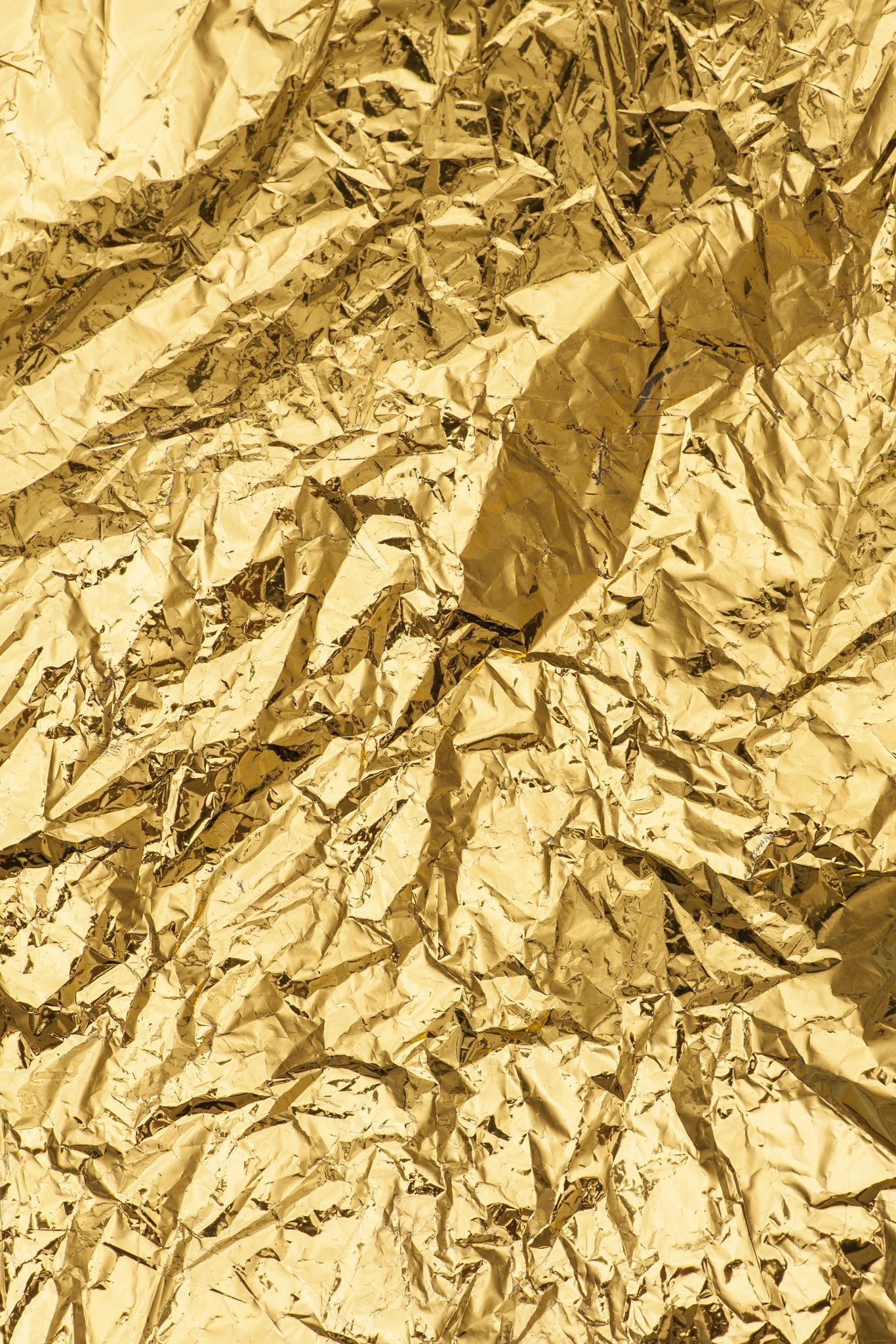 A crumpled sheet of gold foil. - Gold