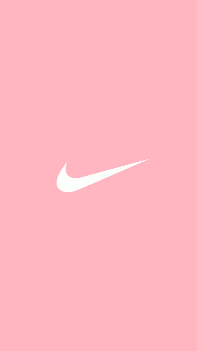 The nike logo is on a pink background - Hot pink