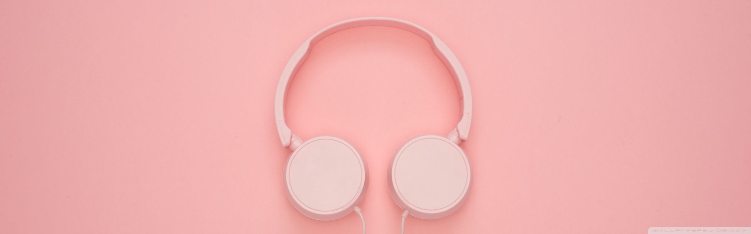 A pair of headphones on pink background - YouTube