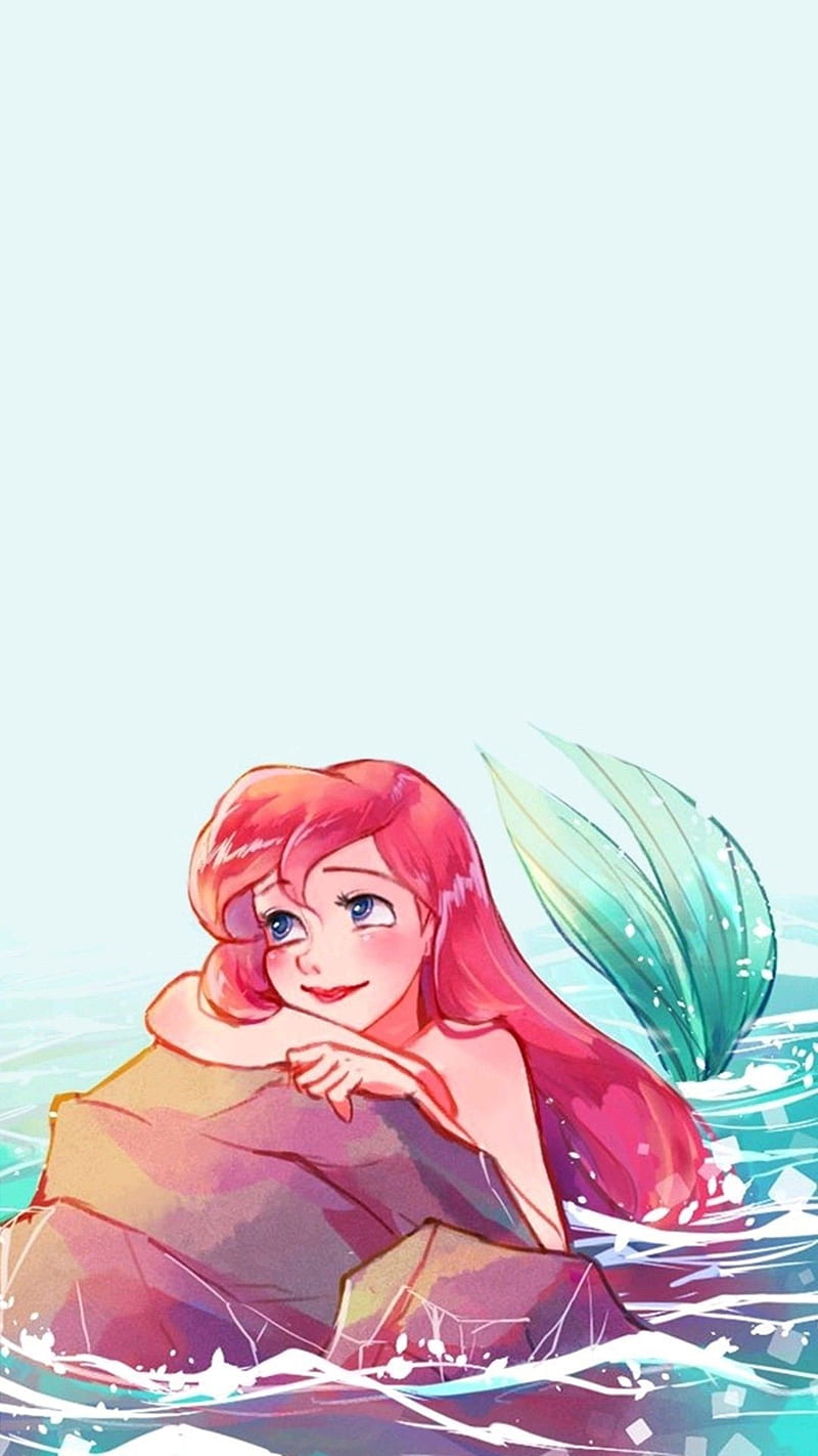 Ariel the little mermaid cartoon character on a rock in the sea - Disney