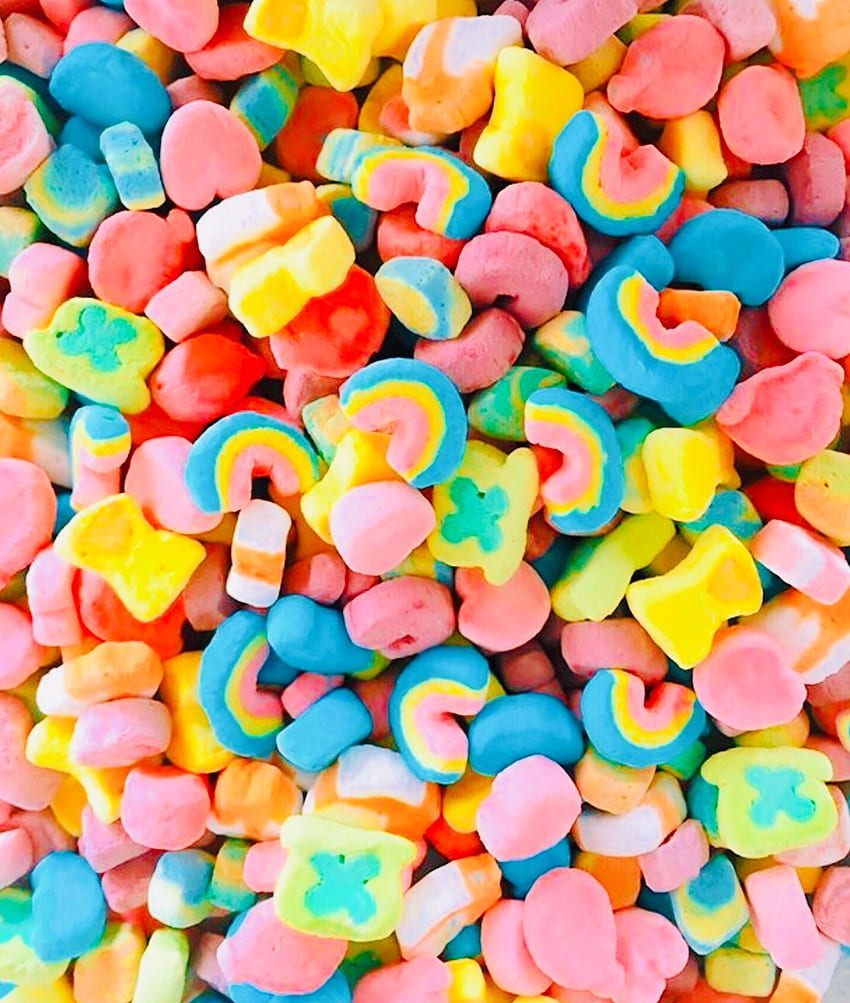 A pile of colorful candy in the shape and rainbow - Food