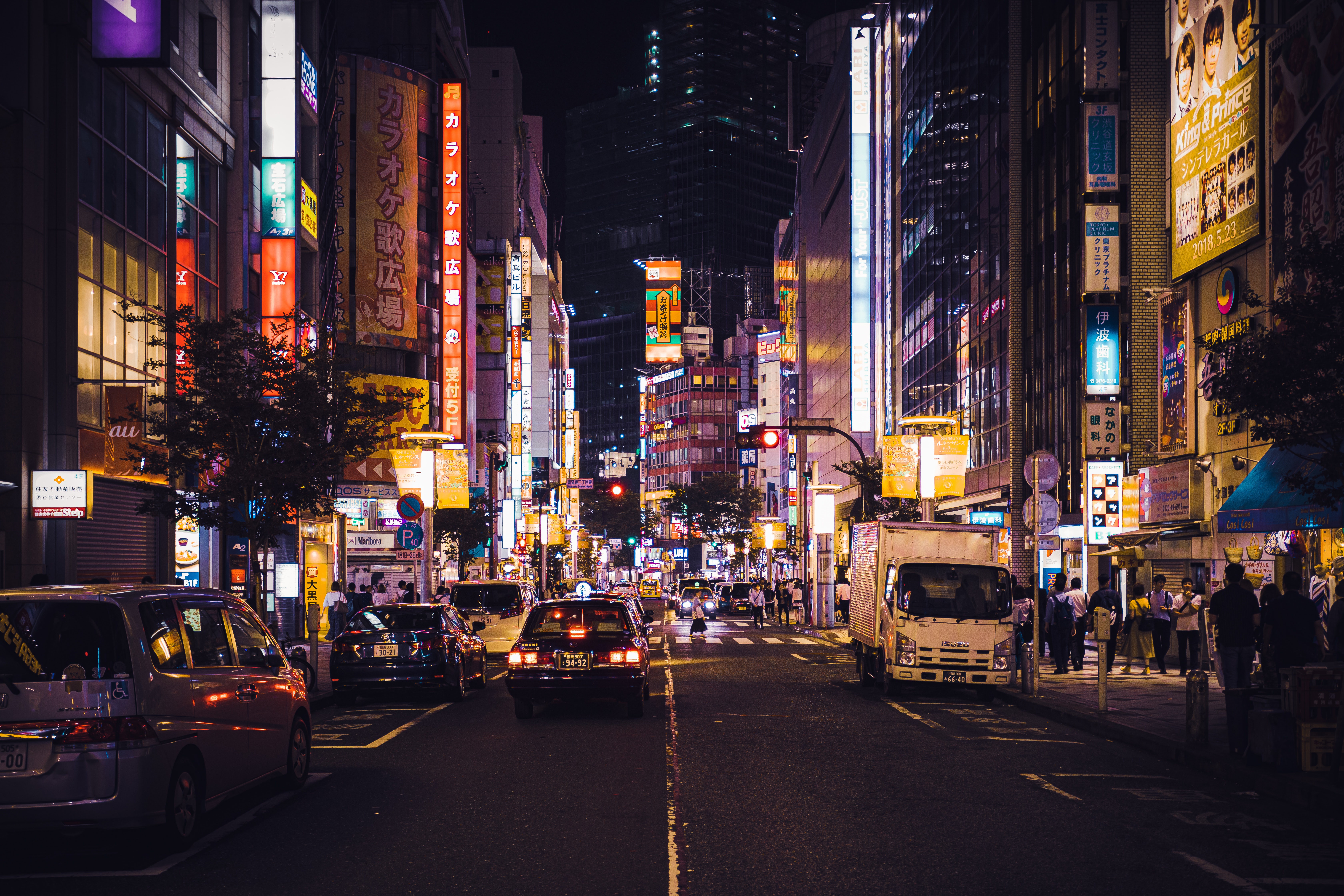 A city street with many cars and buildings - Tokyo