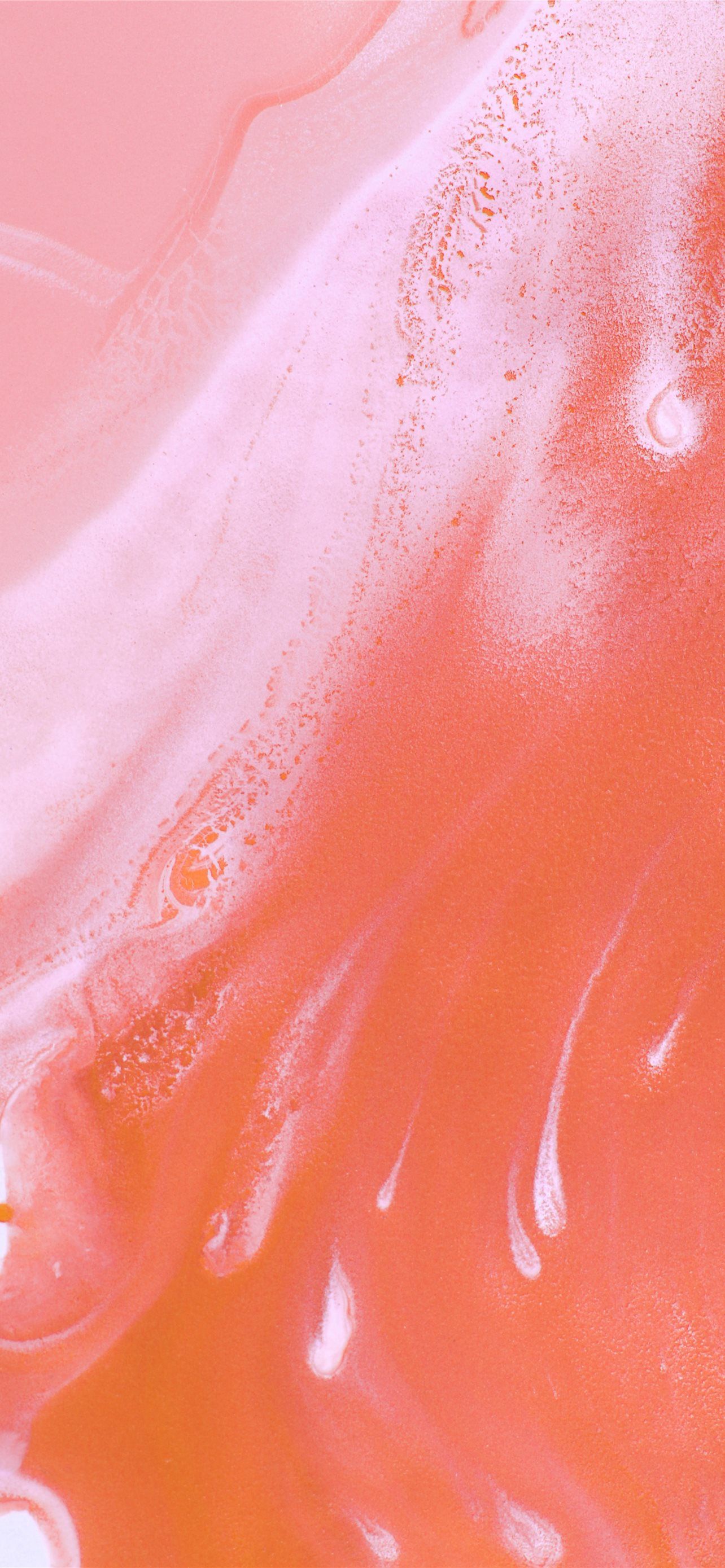 An abstract painting of pink and orange hues. - Coral