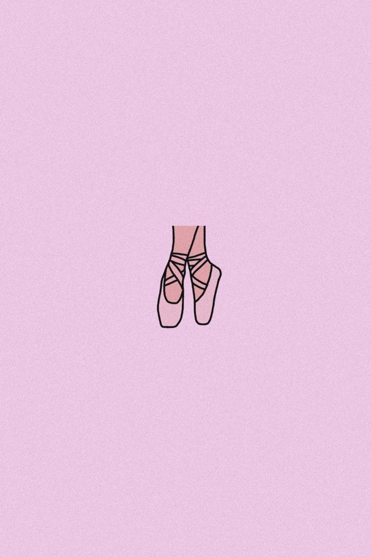 A pair of pointe shoes on a pink background - Dance