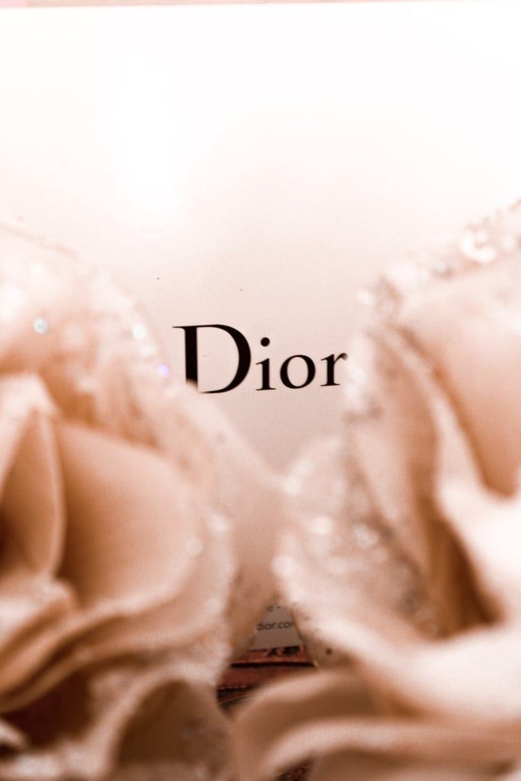 A close up of some flowers and the word dior - Dior