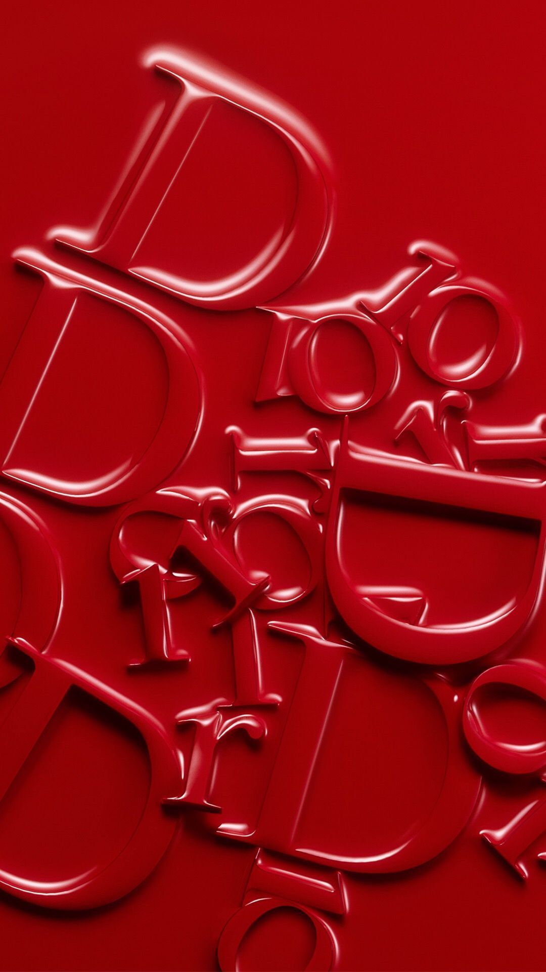 A close up of some letters on red - Dior