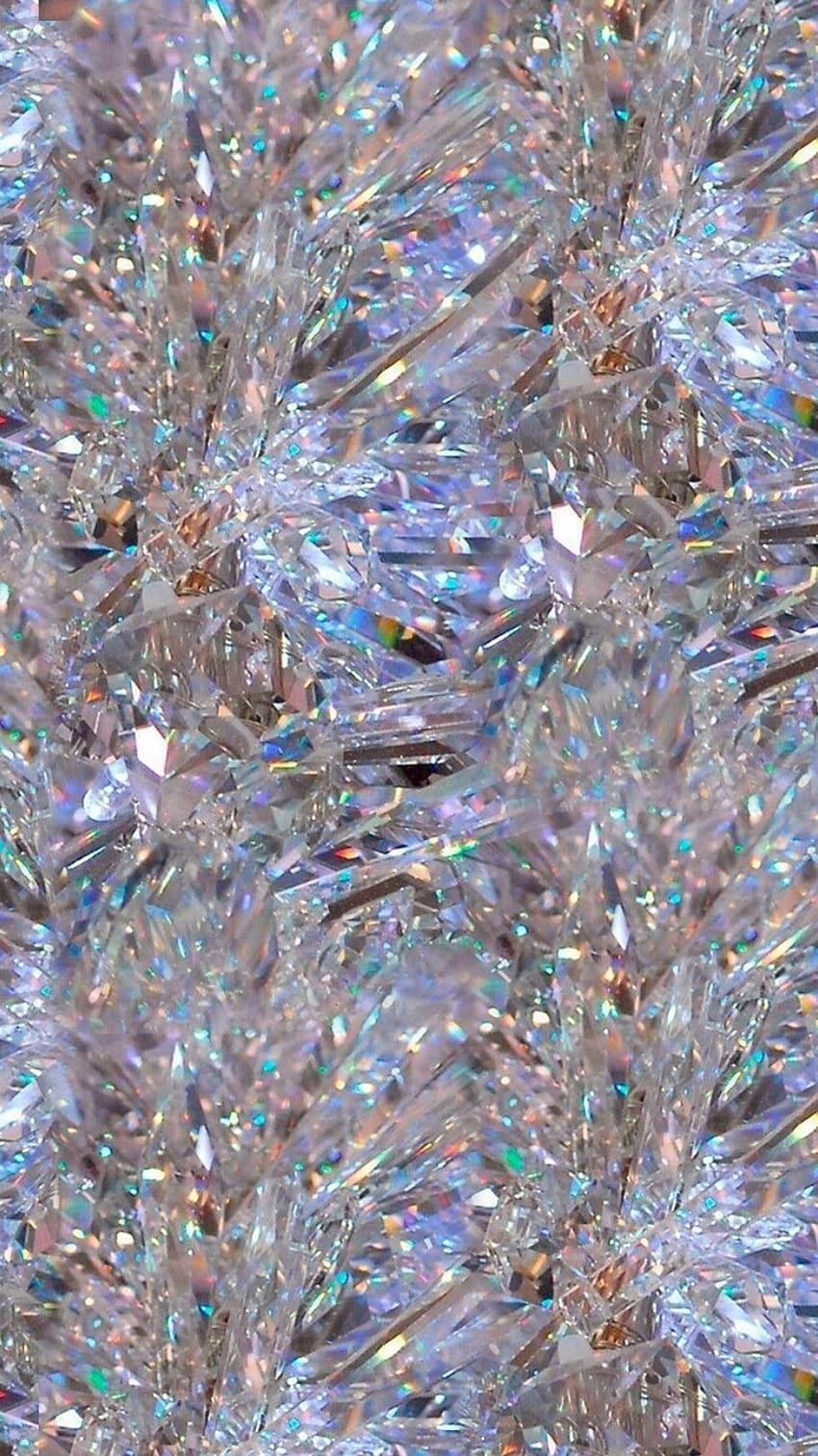 A close up of a pile of clear crystals. - Silver, diamond
