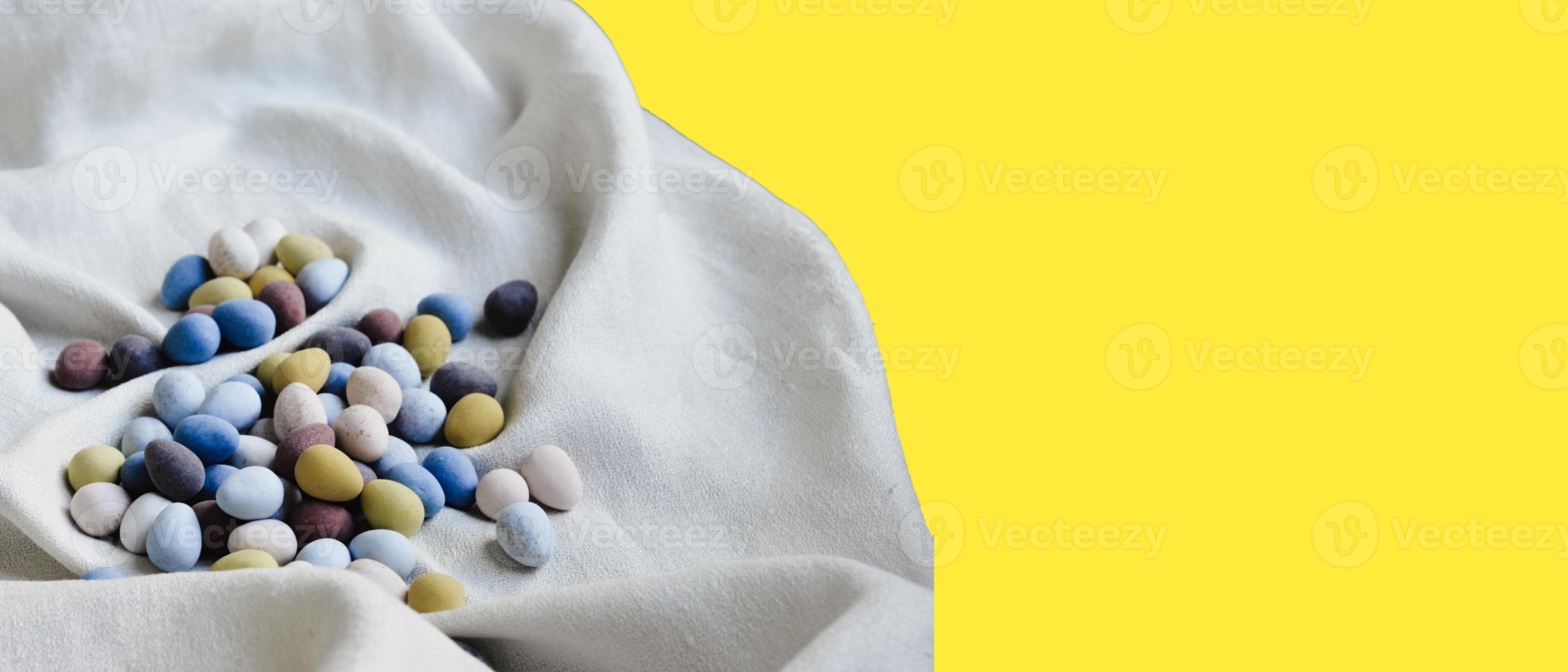 Colored stones on a yellow background photo - 