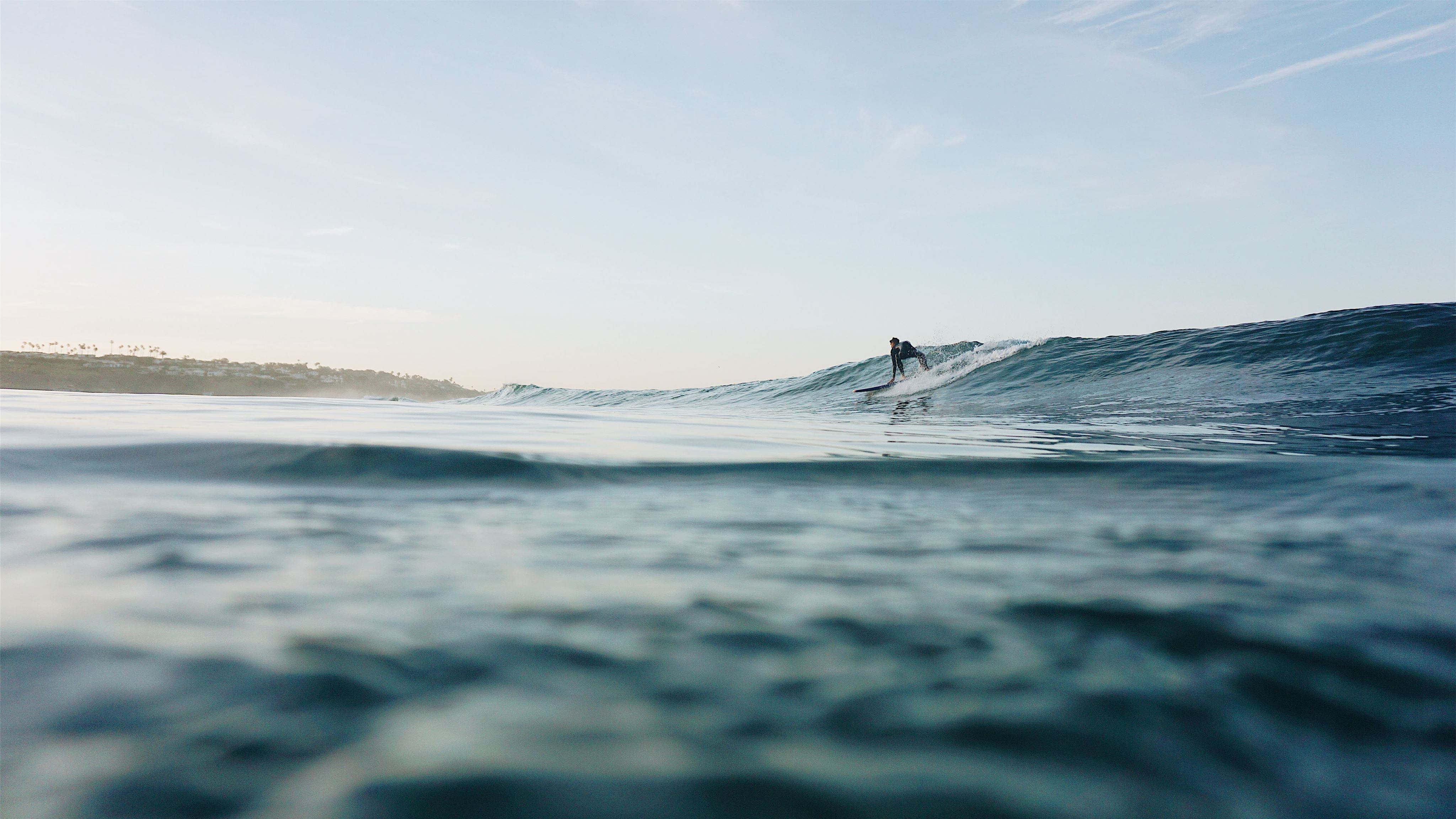 man surfing at sea Mac Wallpaper Download
