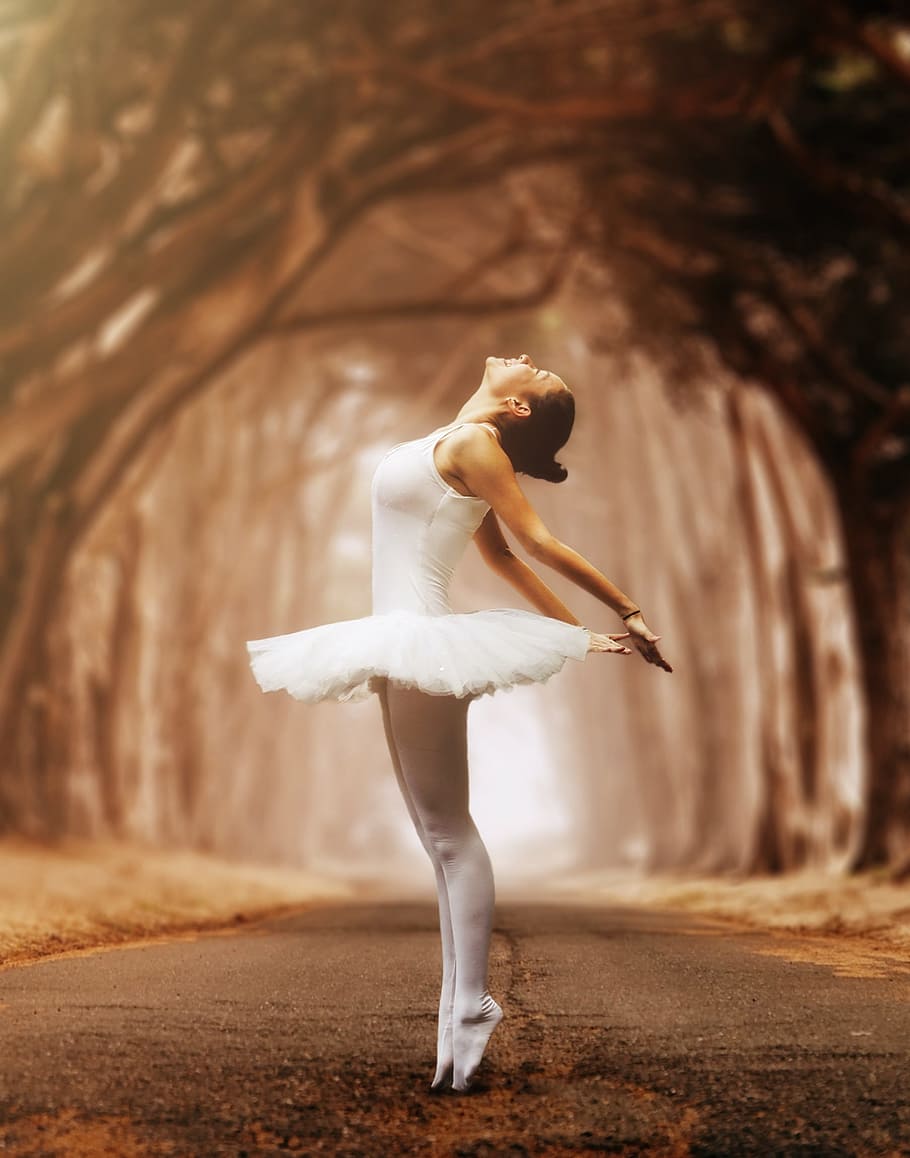 A woman in white ballet outfit is standing on the road - Ballet, dance