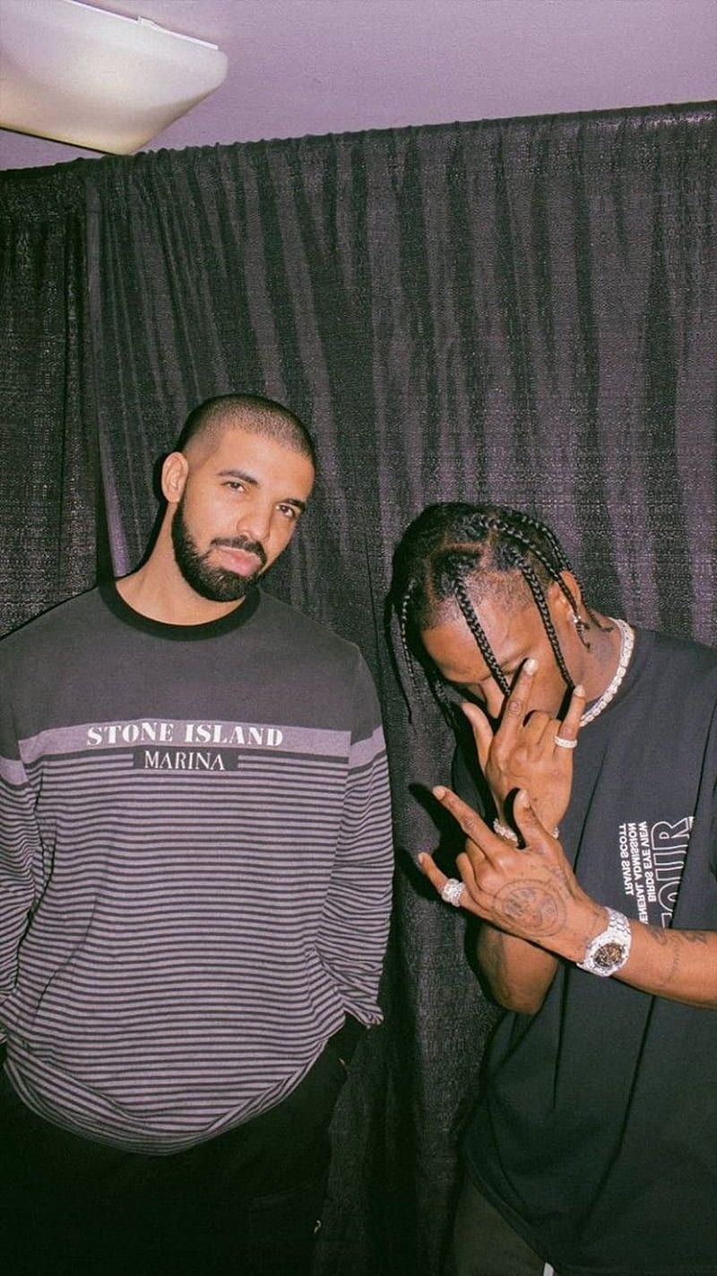 Two men posing for a picture together - Drake