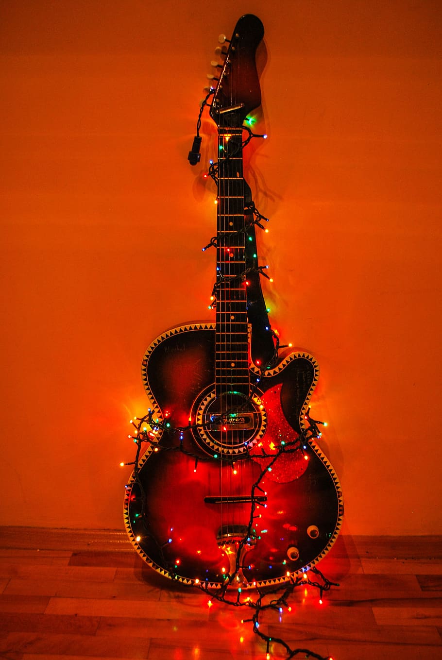 HD wallpaper: acoustic guitar surrounded with string lights against the wall