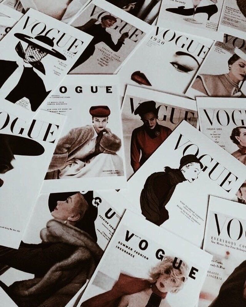 A bunch of vogue magazines are on the table - Fashion, Vogue