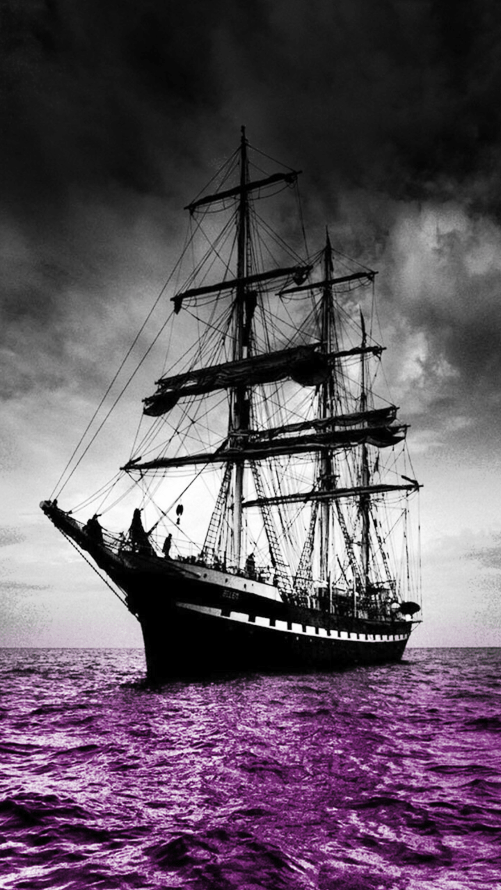 A purple tinted image of a tall ship at sea - Pirate
