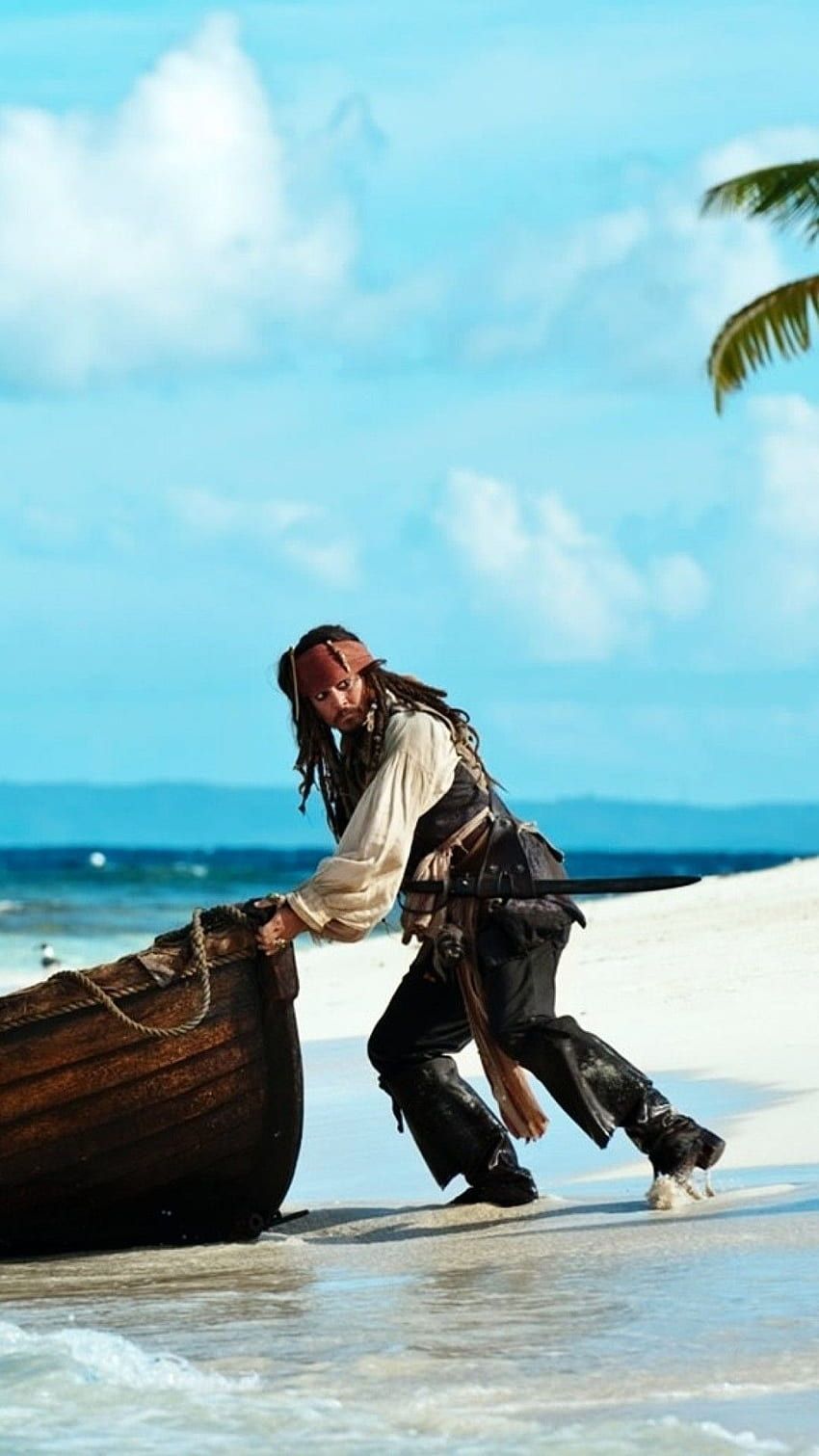 A man in pirate clothing is on the beach - Pirate