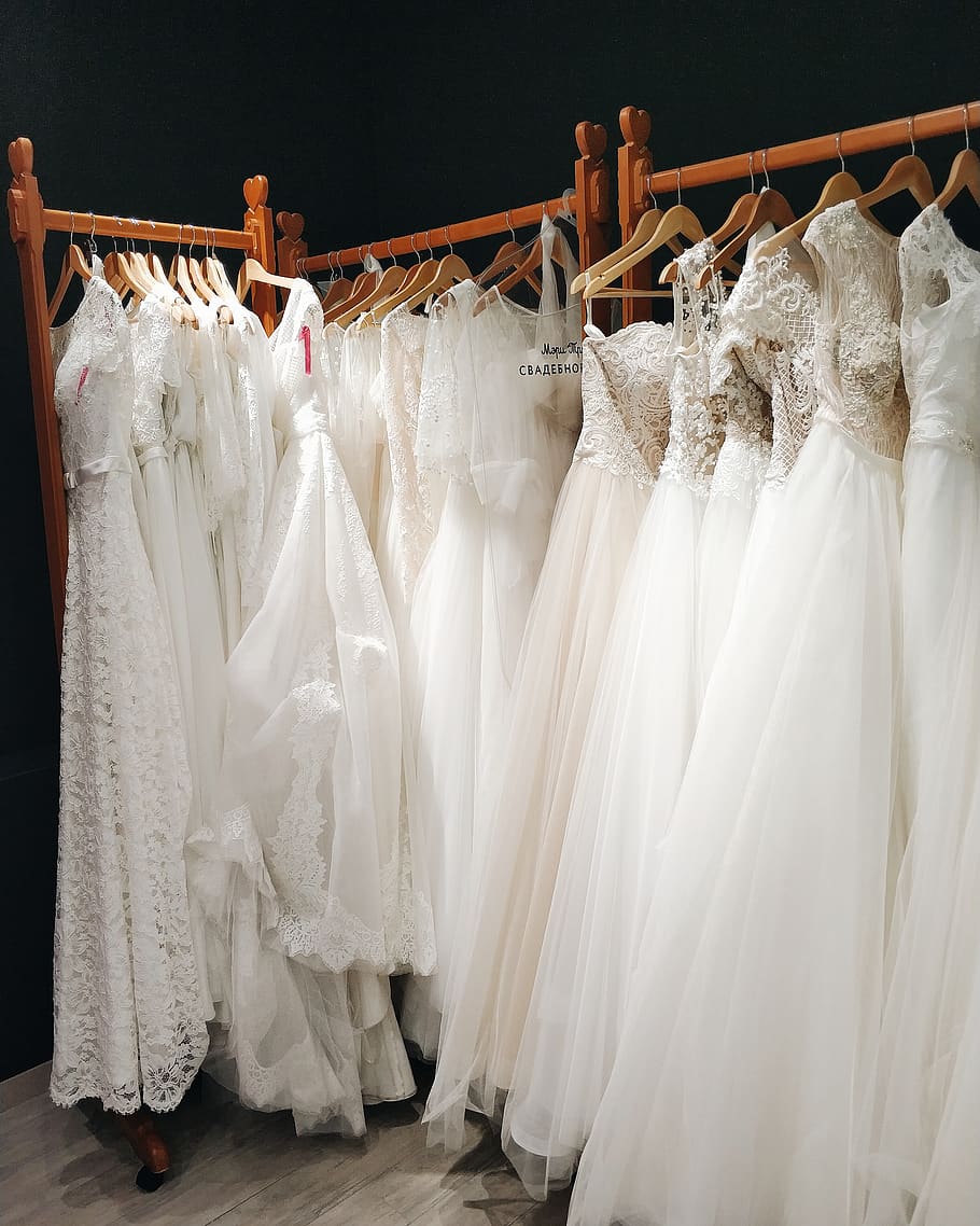 White wedding dresses hanging on a rack - Wedding