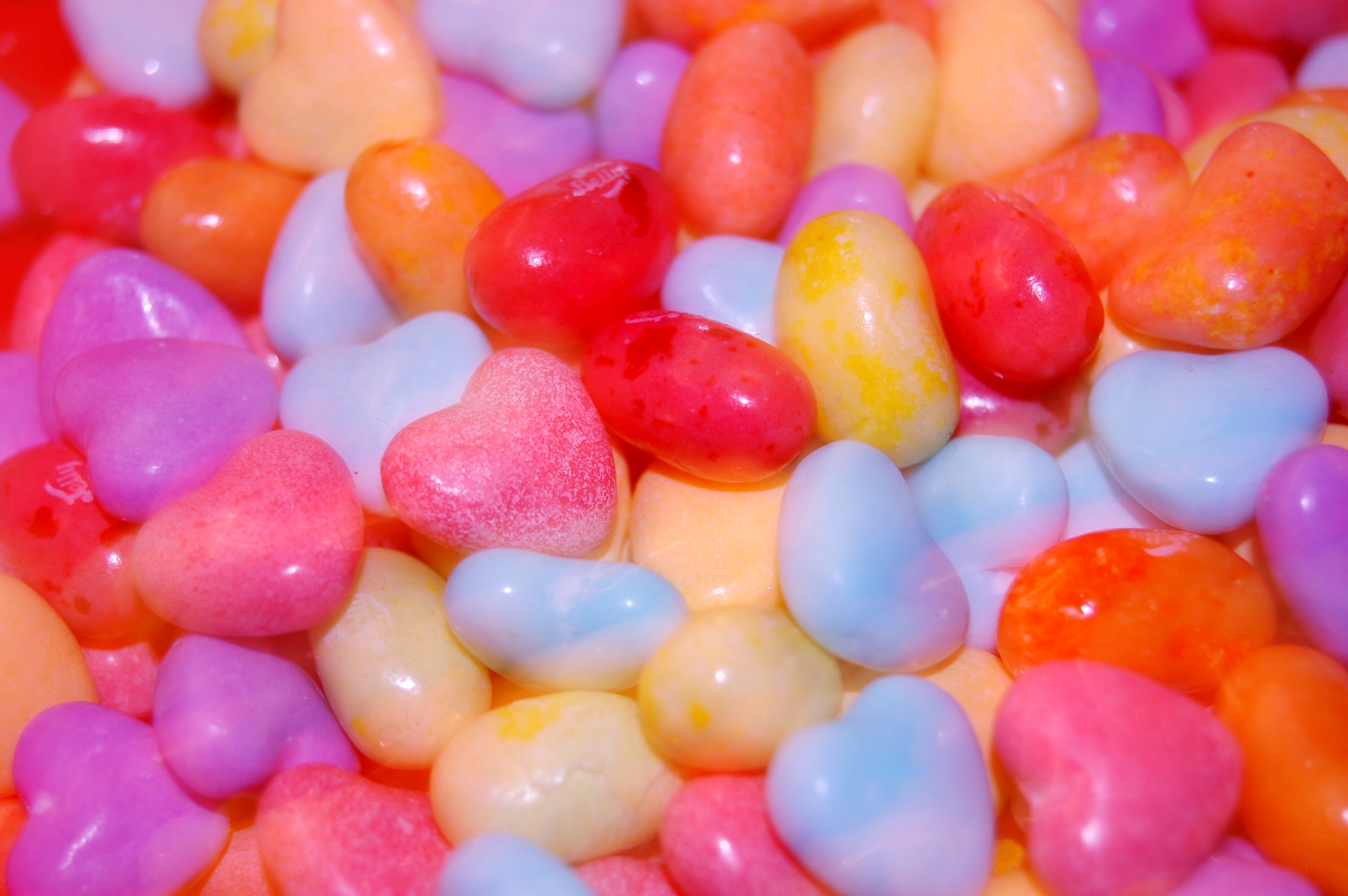 A close up of colorful candy hearts - Candy