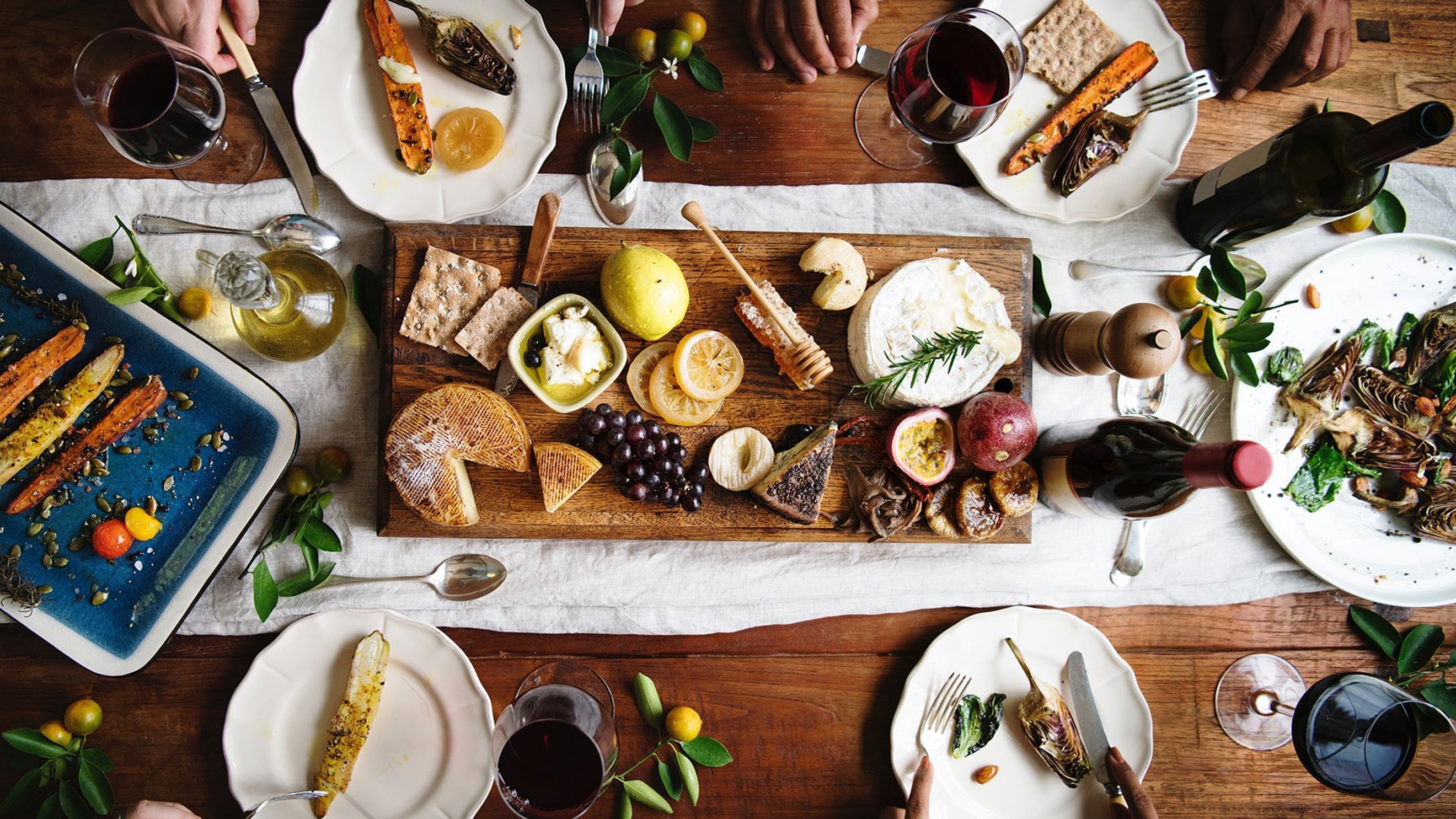 A table with food and wine on it - Foodie