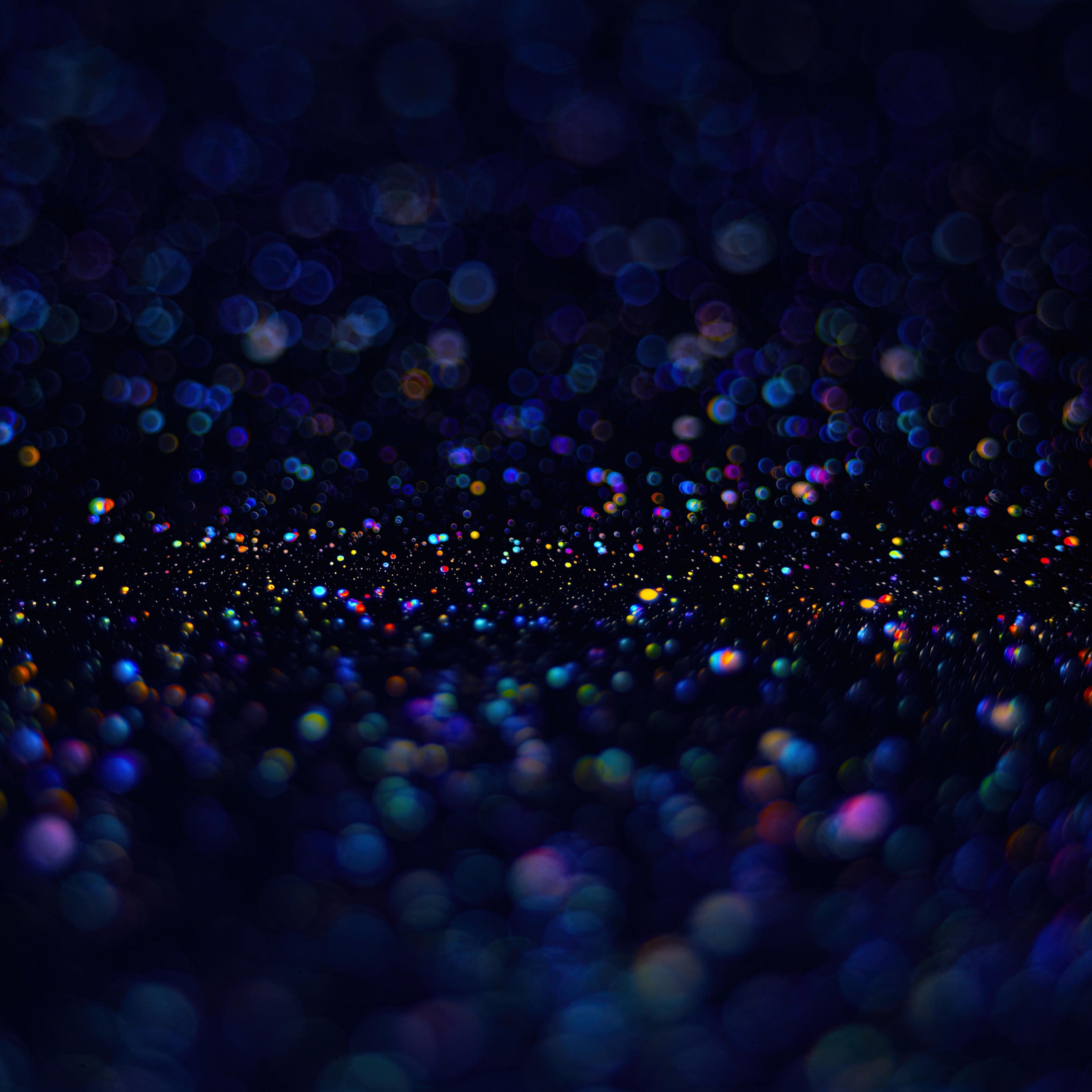 A dark background with colorful dots - Bubbles