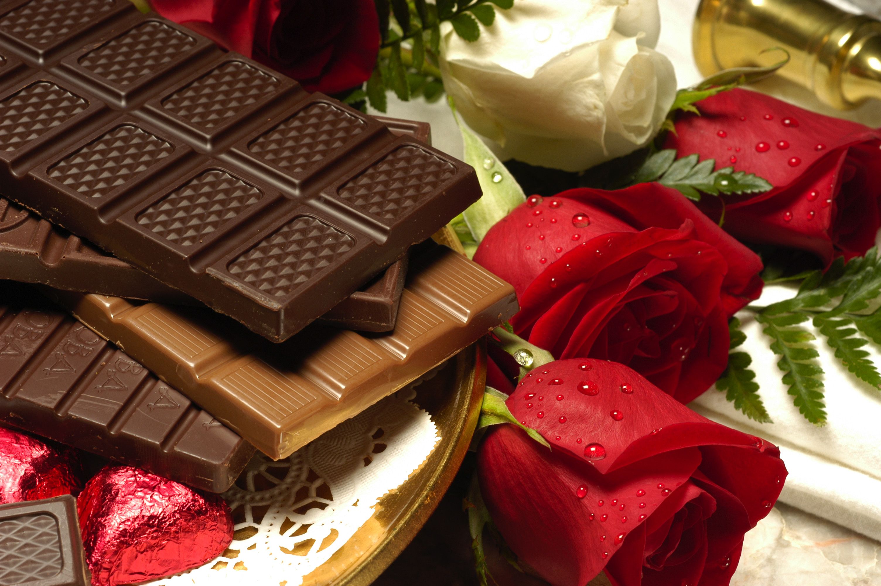 A plate with chocolate bars and roses - Foodie
