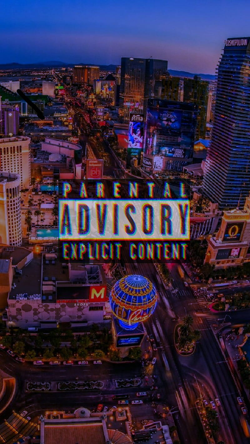 Parental advisory warning sign over a cityscape at night - Las Vegas