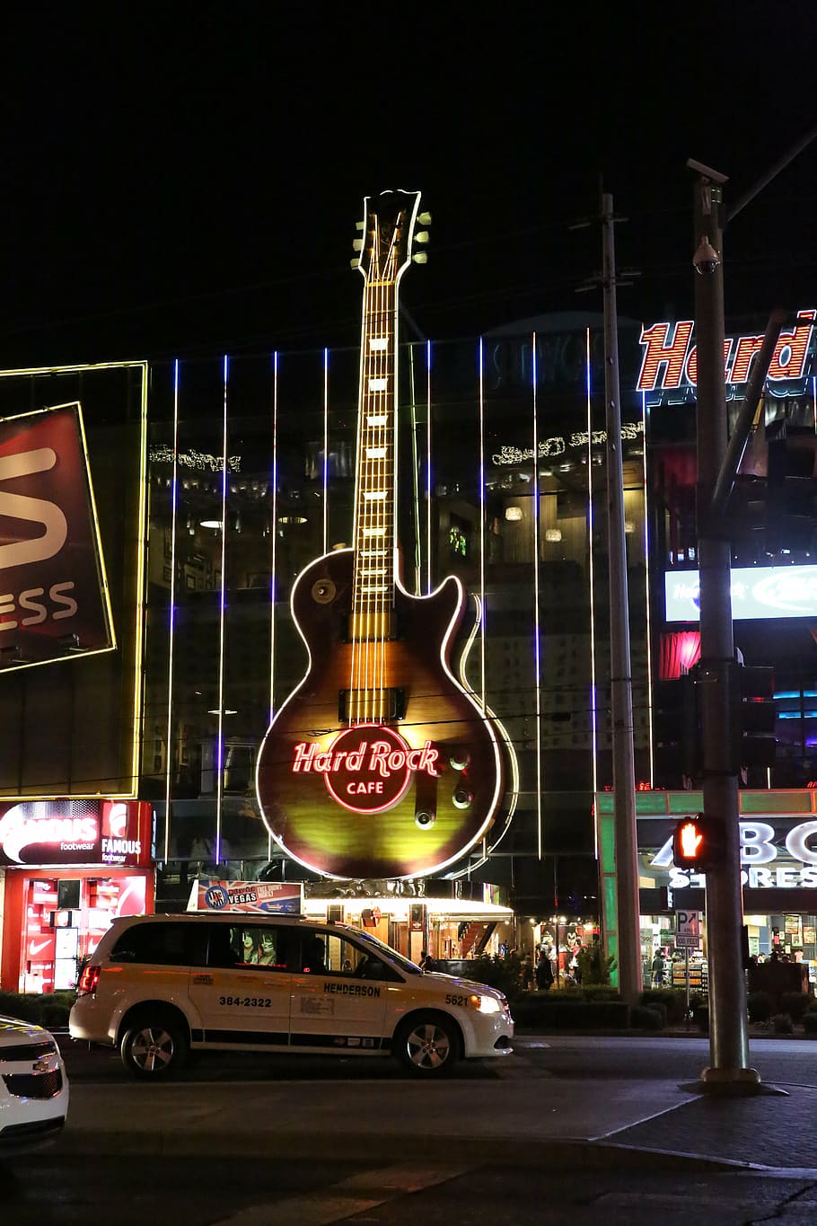 A guitar shaped building with neon lights - Las Vegas