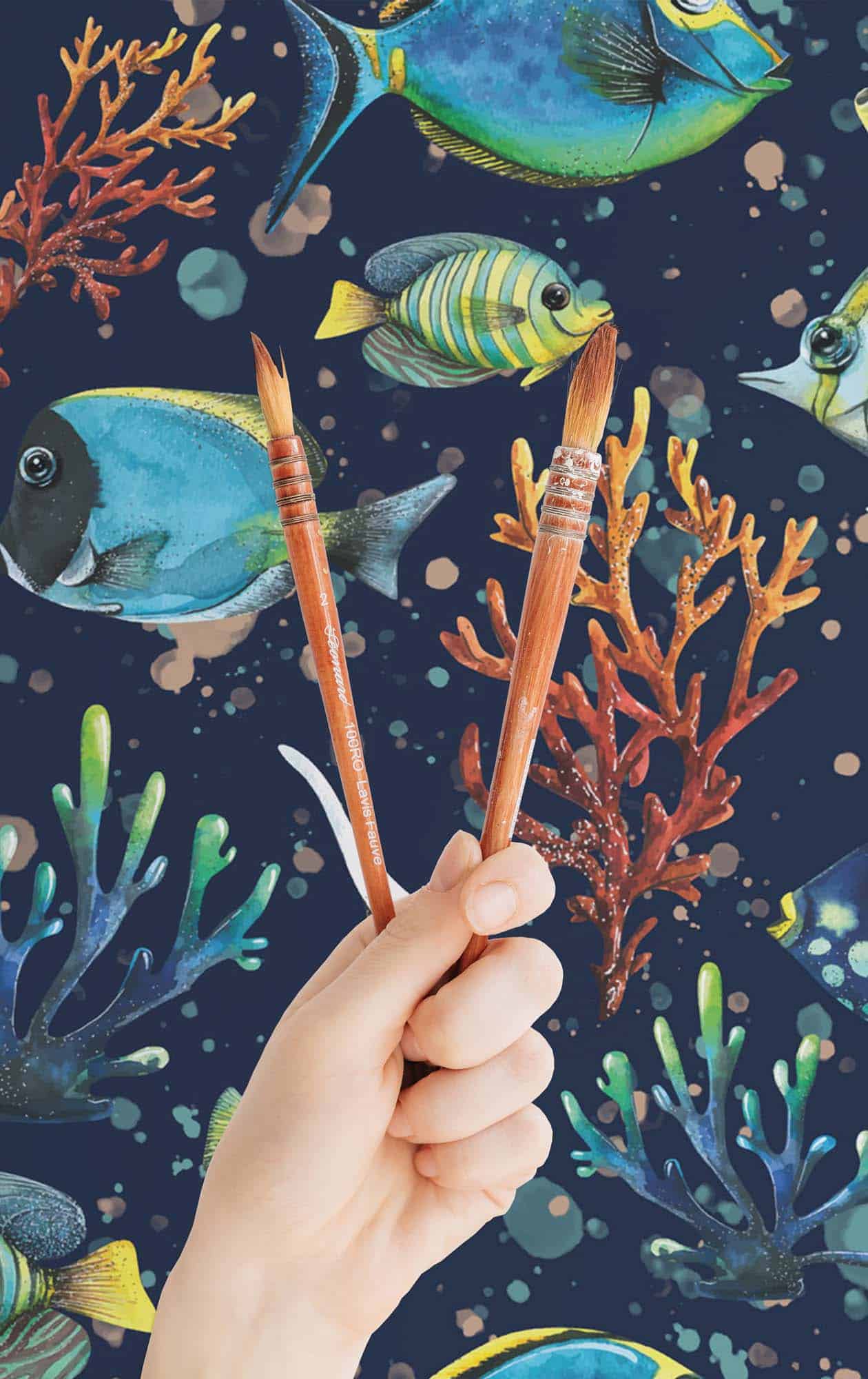 A hand holding two brushes against a background of fish and coral. - Koi fish