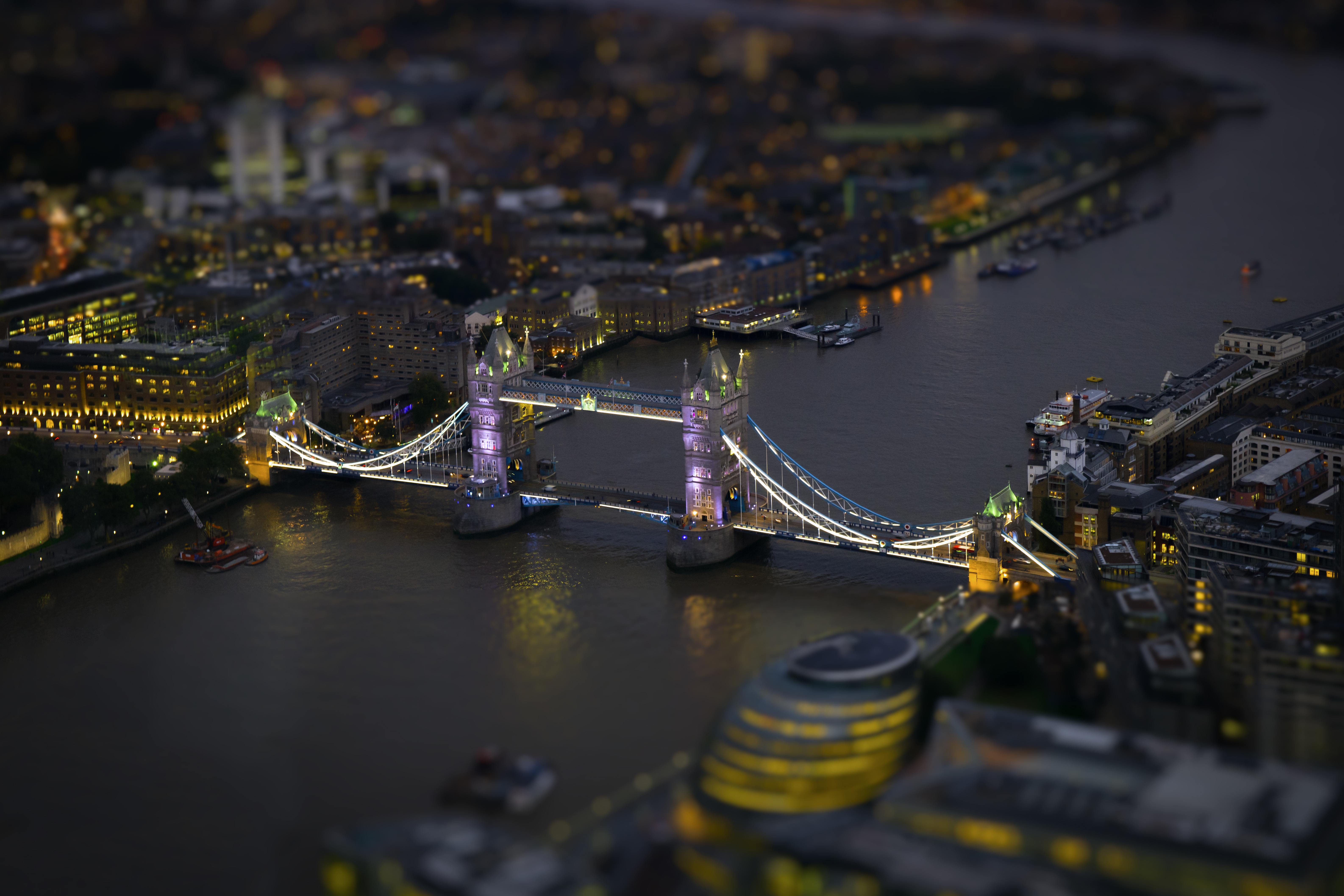 A model sized Tower Bridge in London, lit up at night - London