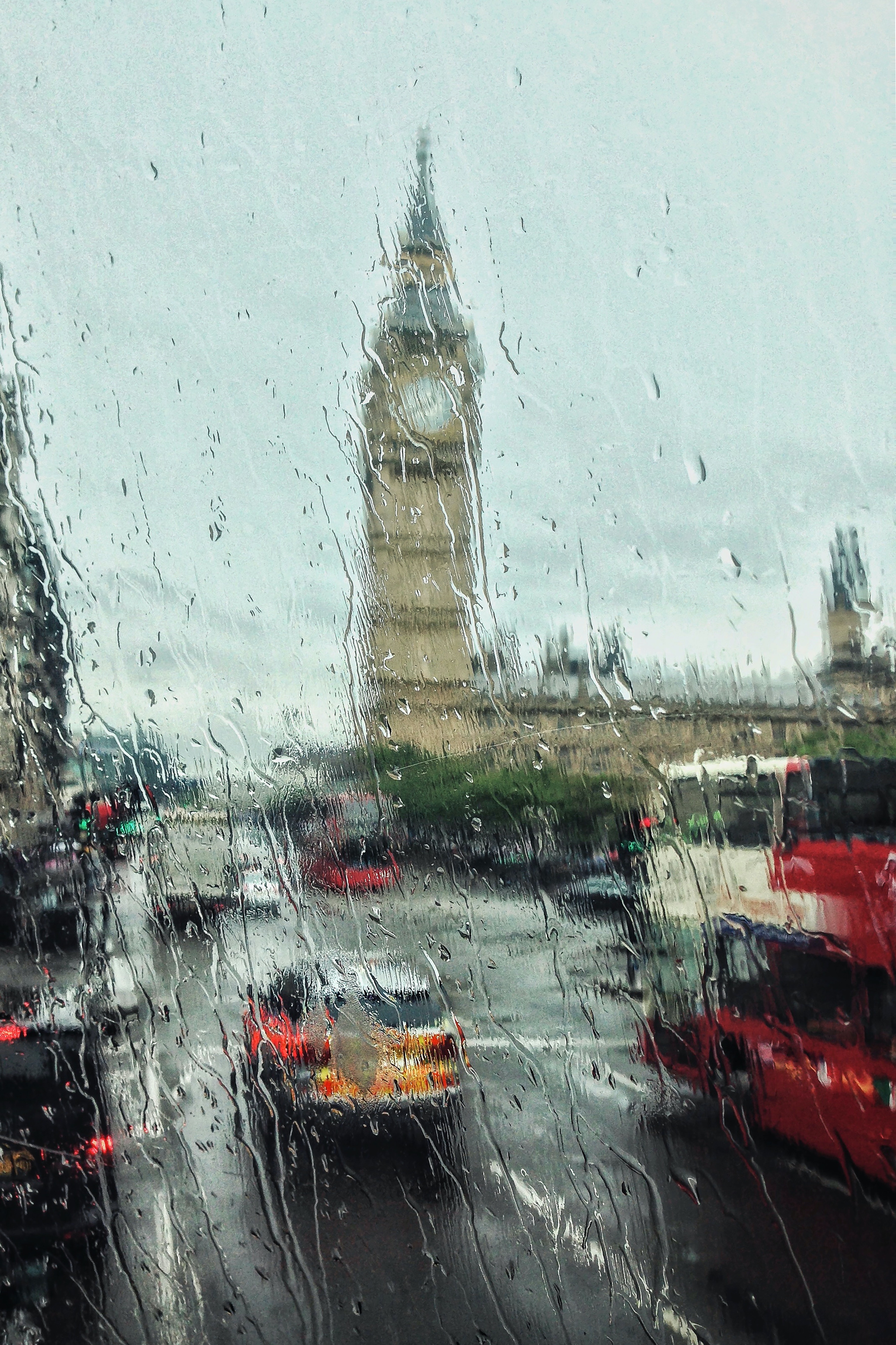 A rainy window with a view of the Big Ben clock tower in London. - London