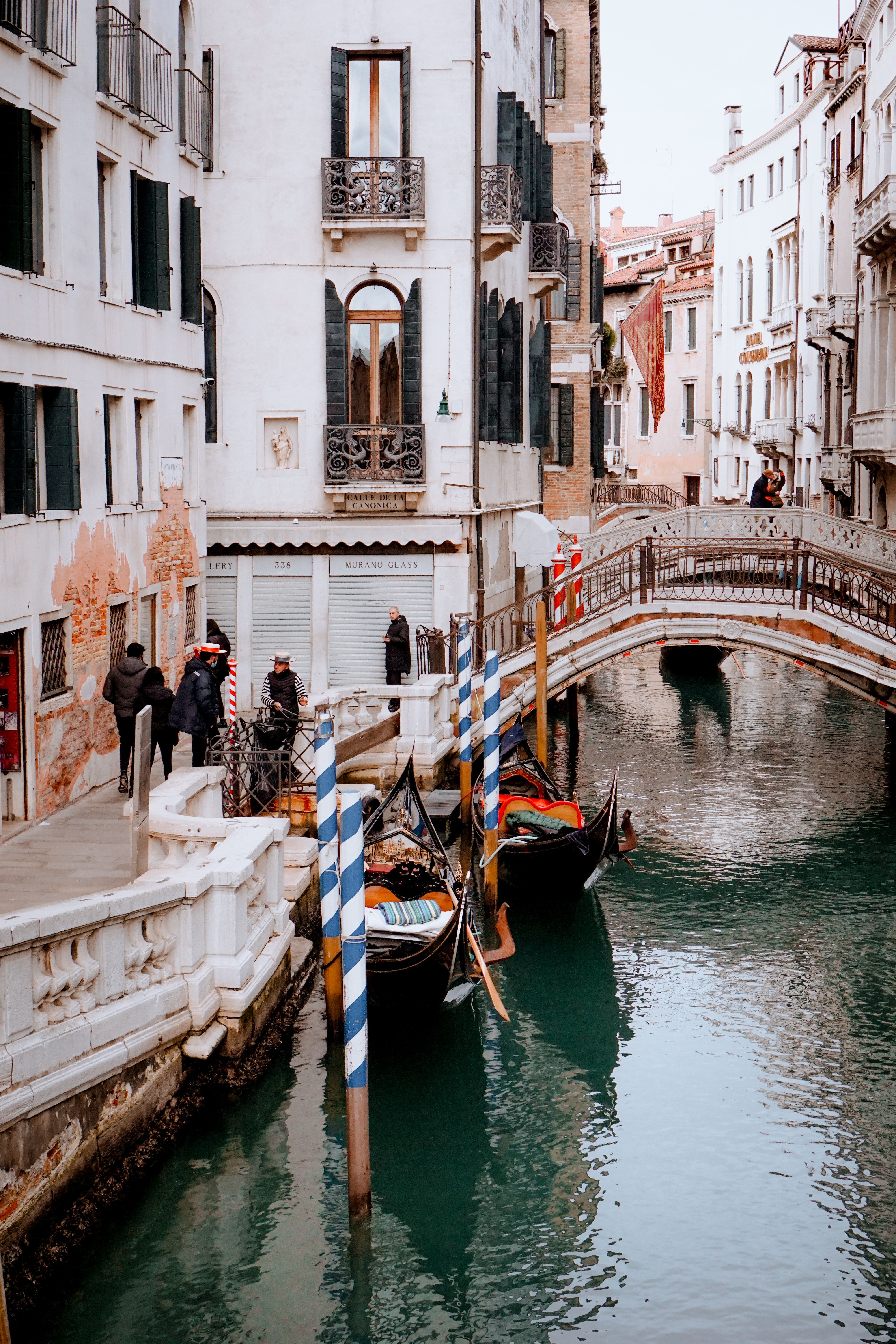 A canal with boats and buildings on it - Italy