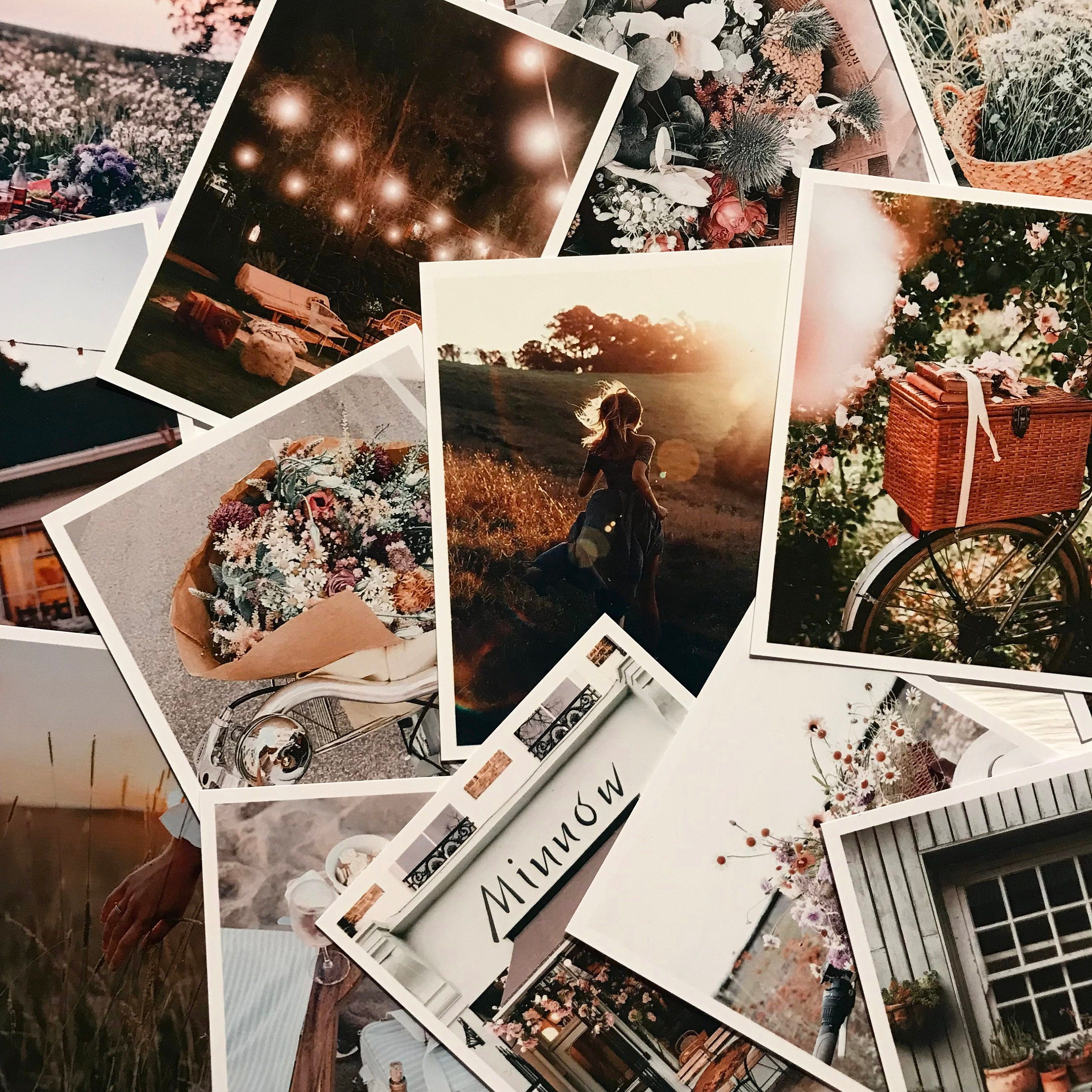 A collection of photographs on the table - Polaroid