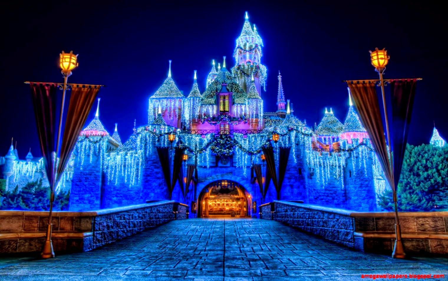 A castle that is lit up at night - Disneyland