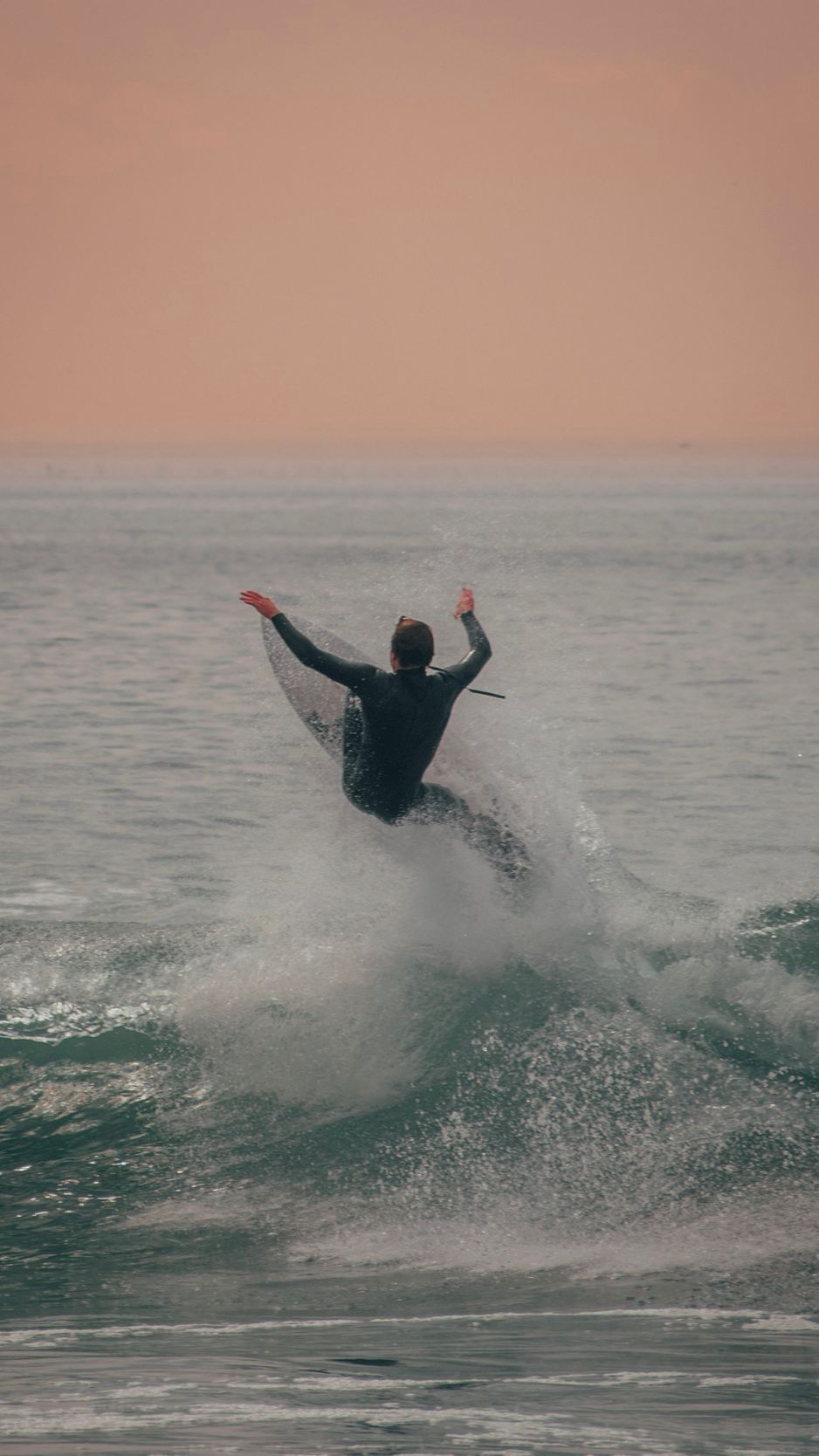 A man riding on top of the water - Surf