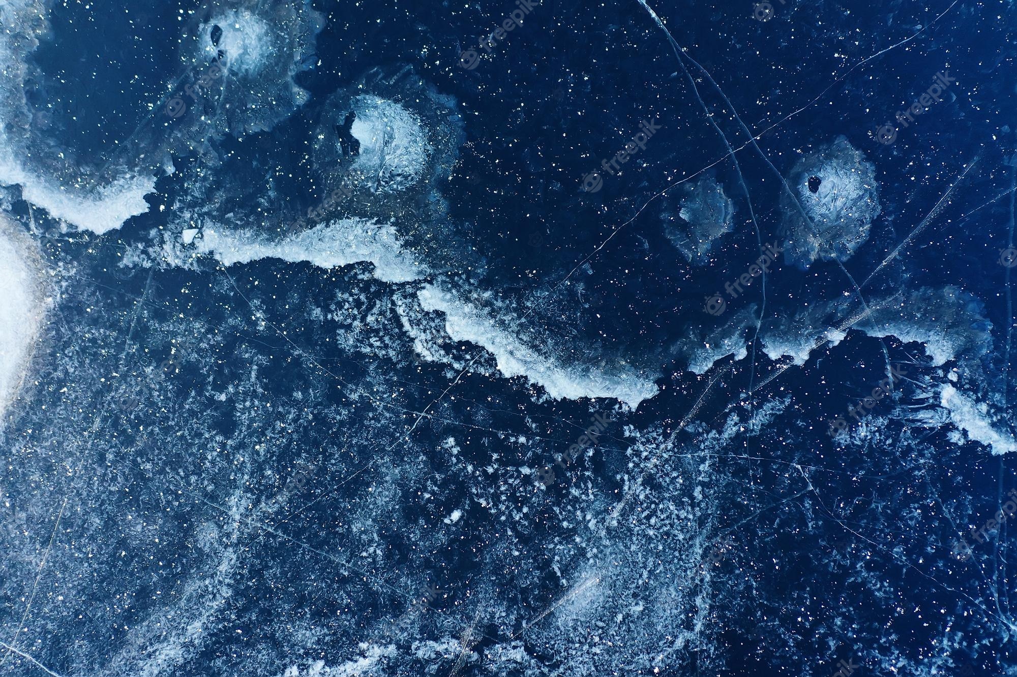 A close up of the ocean with waves - Ice