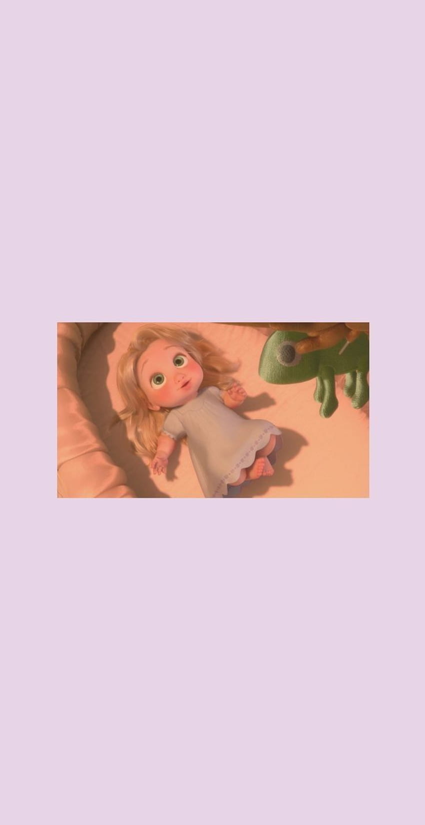 A little girl laying in her bed with an animal - Rapunzel