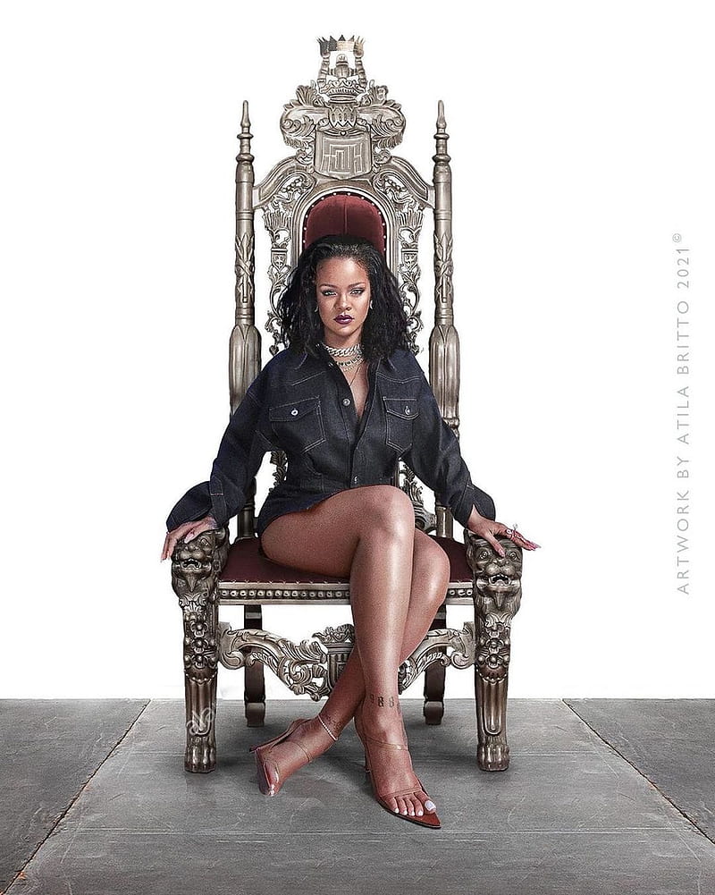 Rihanna sitting on a throne in a black denim jacket and no pants - Rihanna