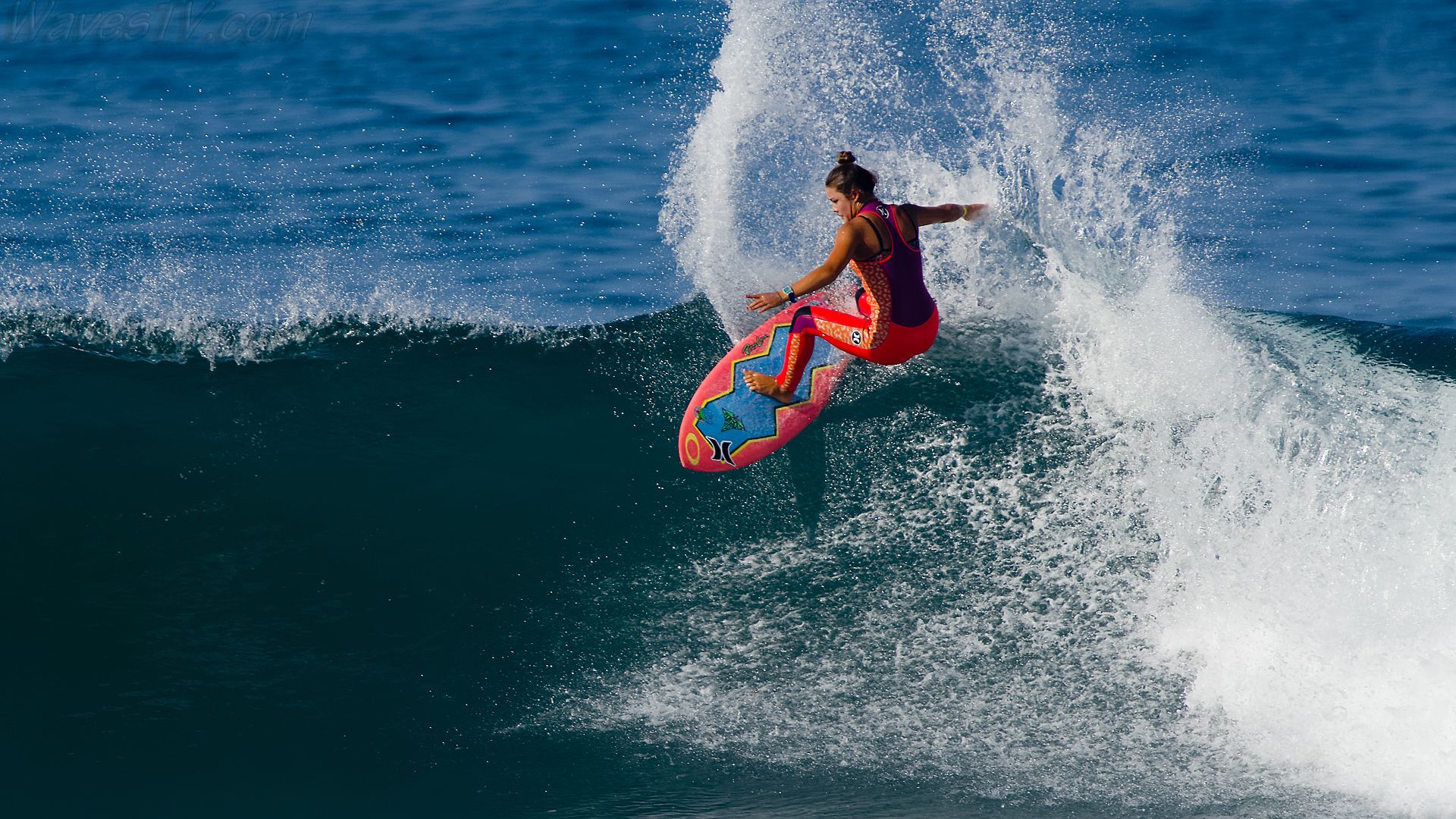 A woman surfing on top of the water - Surf