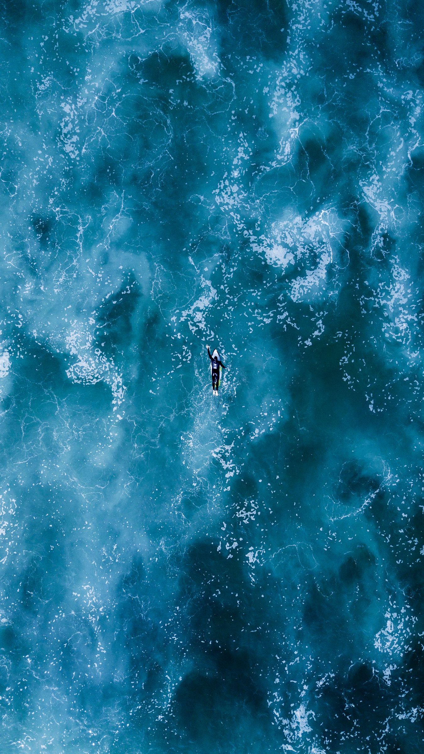 Aerial view of a person in the middle of the ocean - Surf, ocean