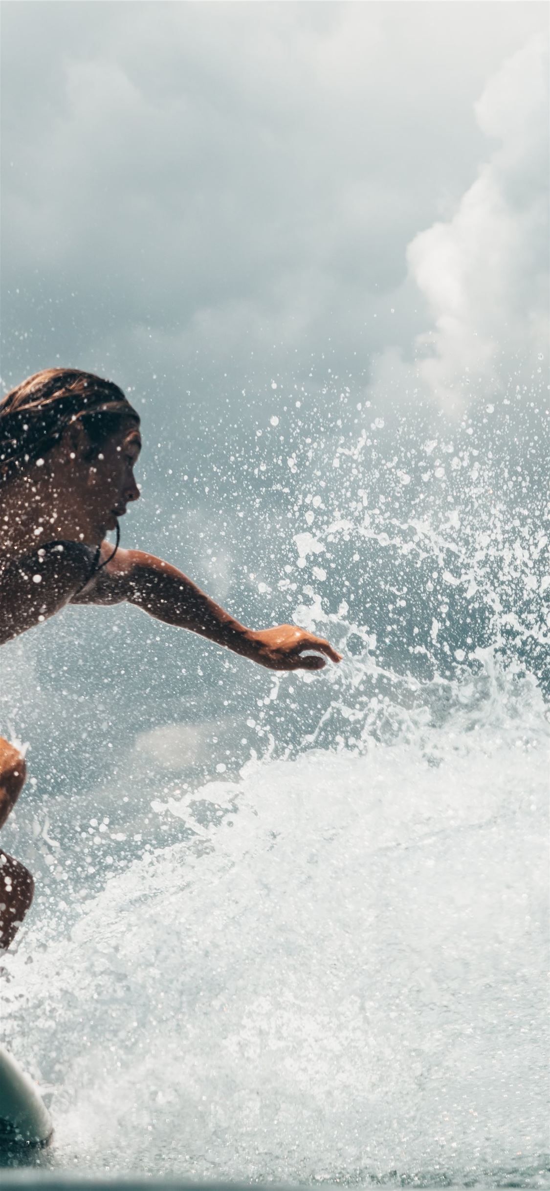 A man riding on top of the water - Surf