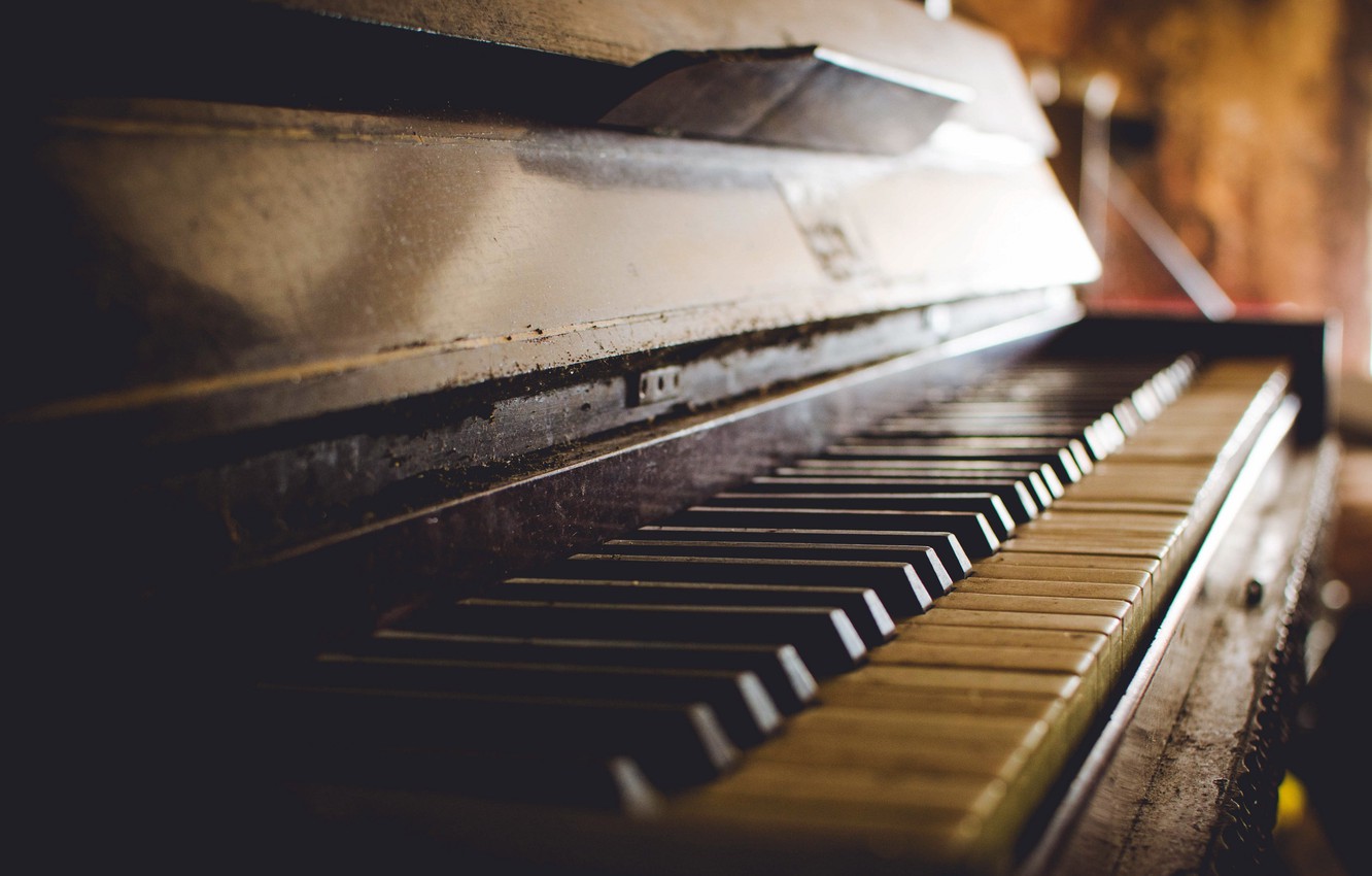 A close up of an old piano - Piano